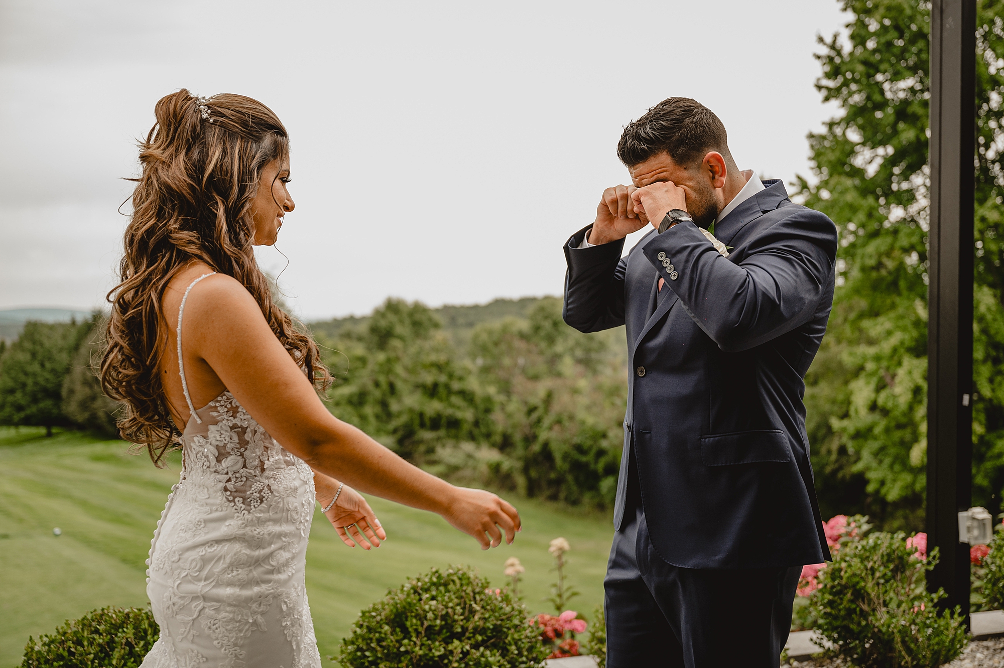 groom wipes tears during first look at Skyview Golf Club