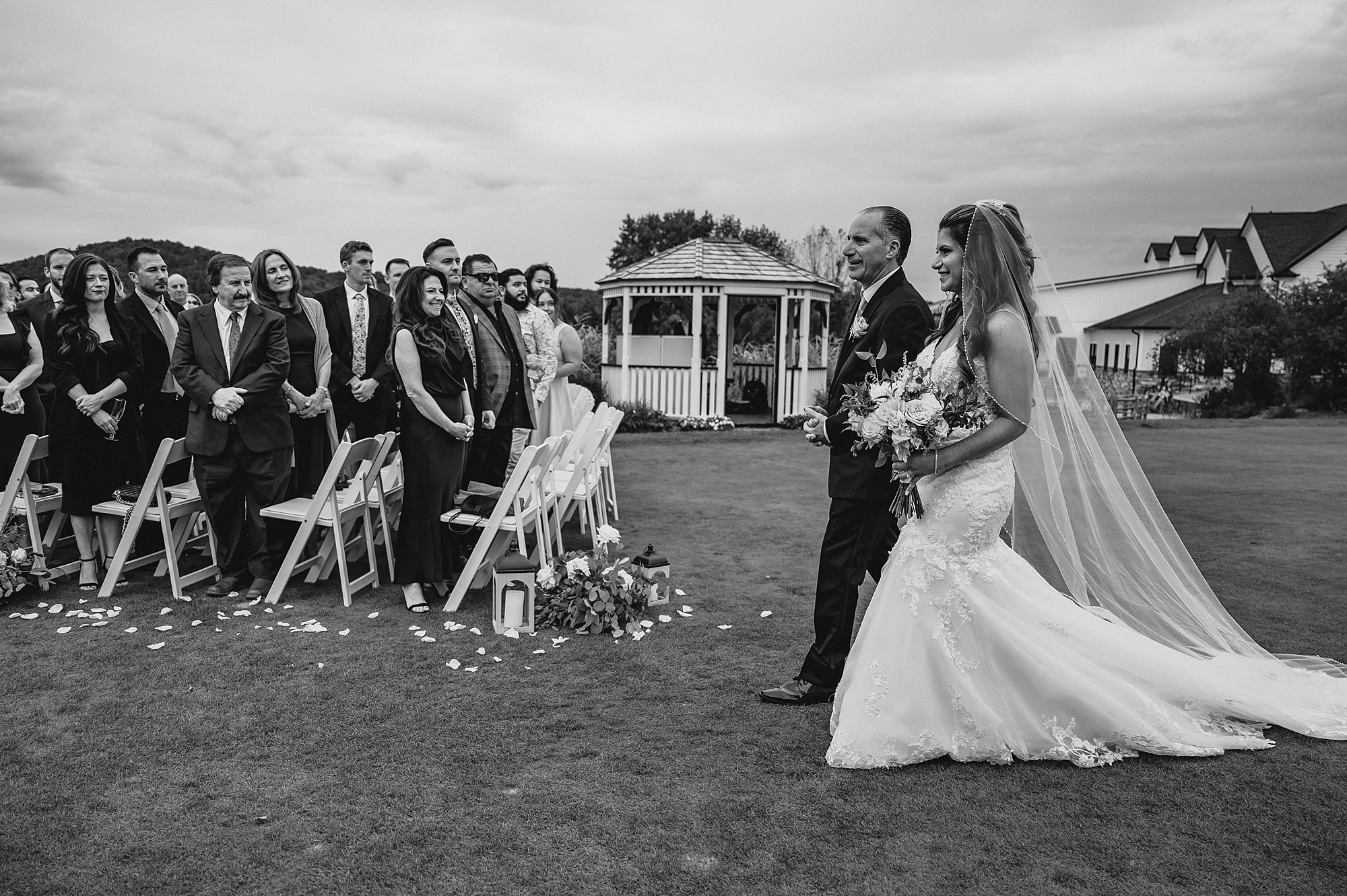 father escorts bride for ceremony on lawn at Skyview Golf Club
