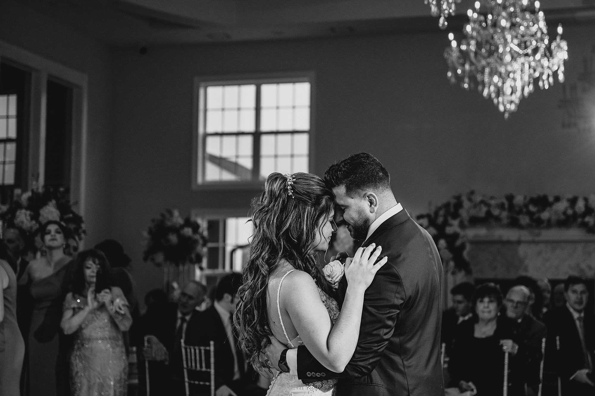 bride and groom lean heads together during first dance in Sparta NJ wedding reception