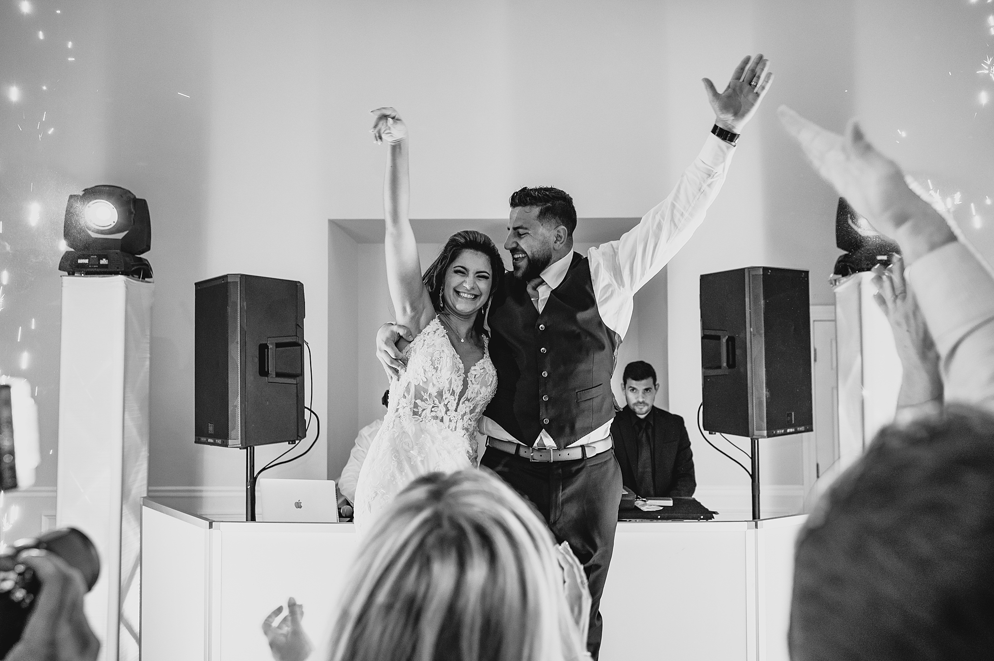 bride and groom dance in front of DJ during New Jersey wedding reception