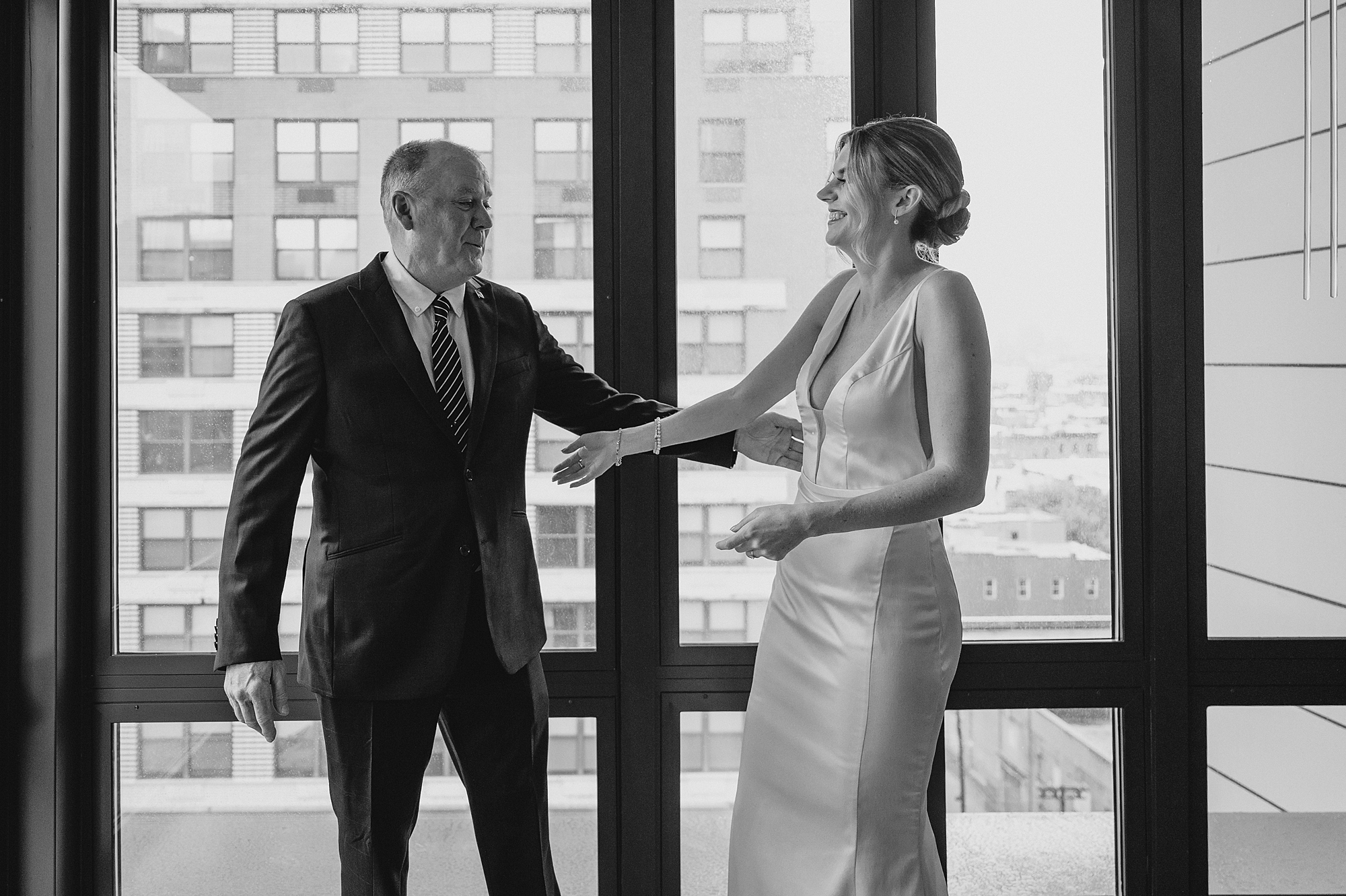 bride and father hug during first look inside Jersey City hotel