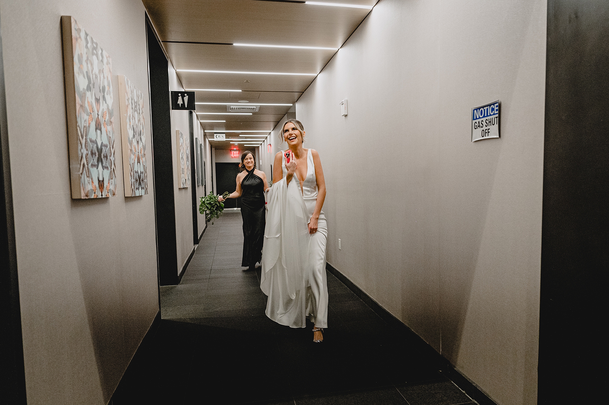 bride walks down hallway in Jersey City hotel