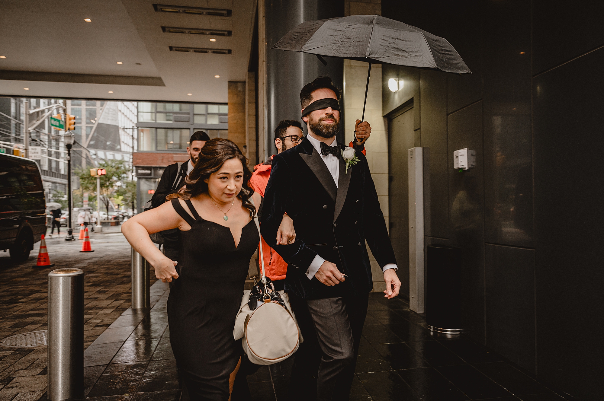 family guides blindfolded groom through hotel in Jersey City