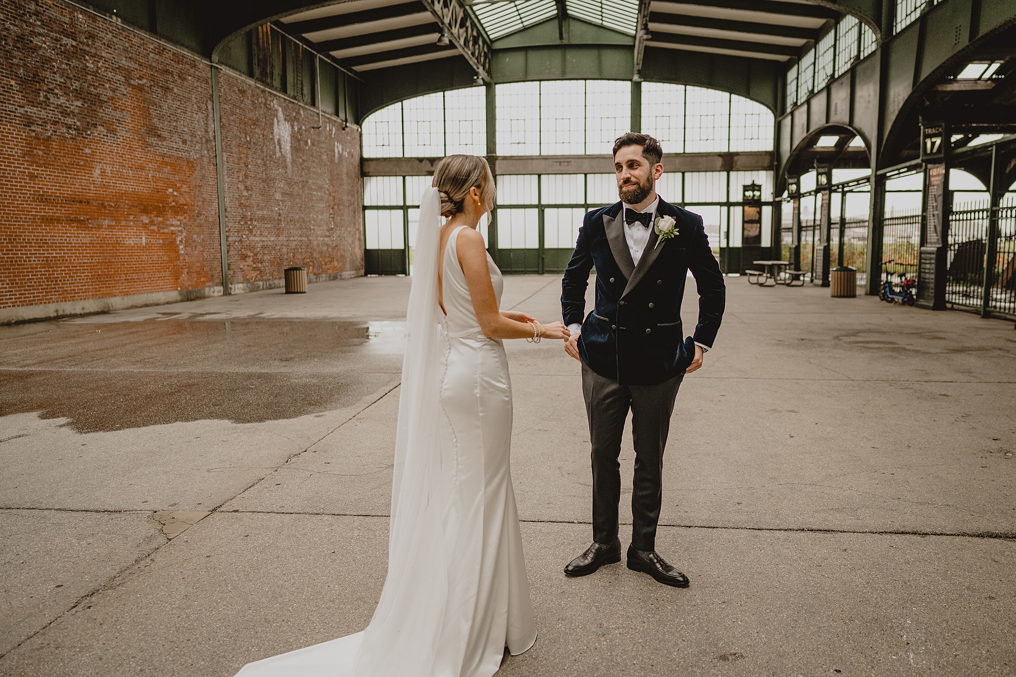bride walks to groom during first look at Maritime Parc
