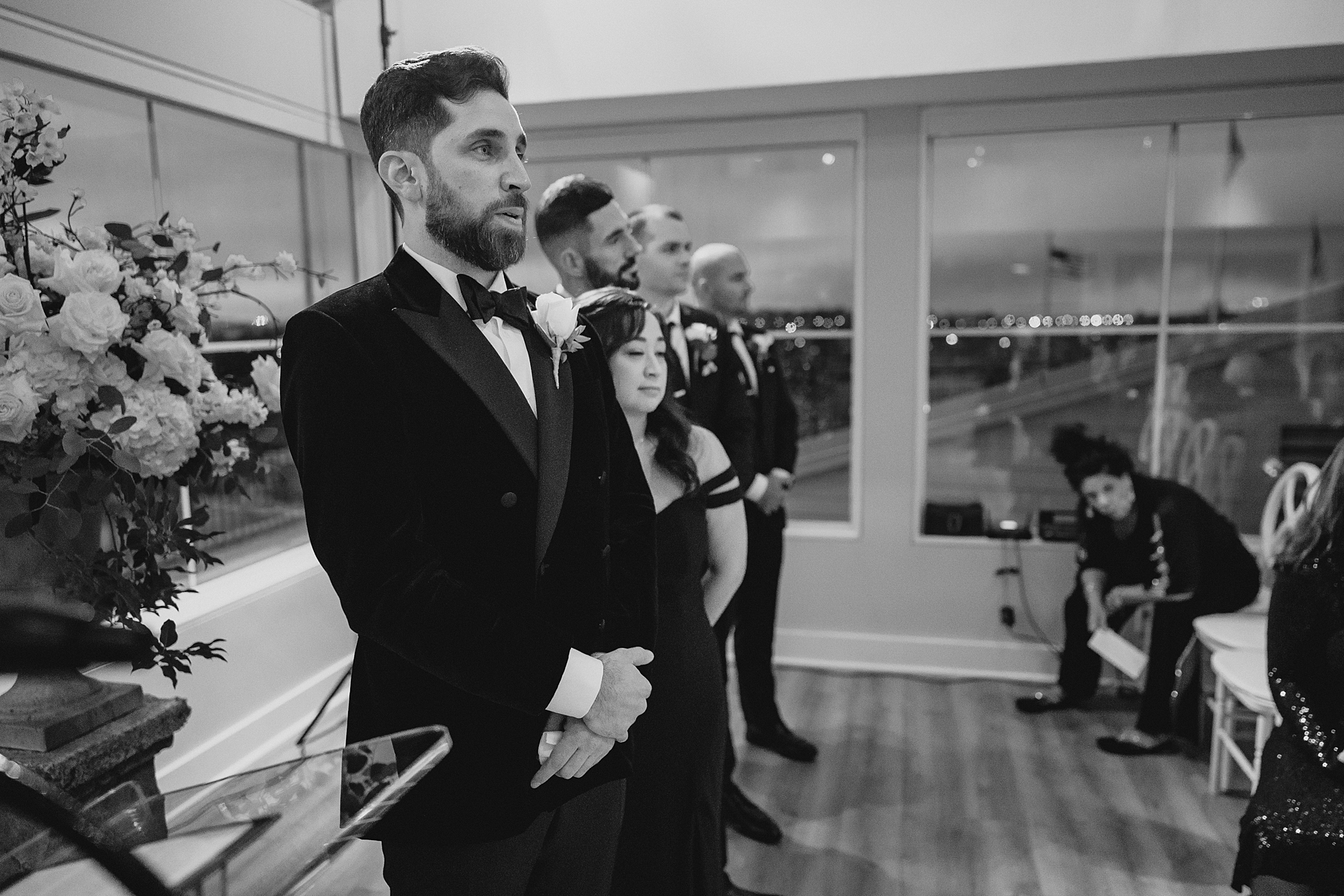 groom tears up during wedding ceremony inside Maritime Parc