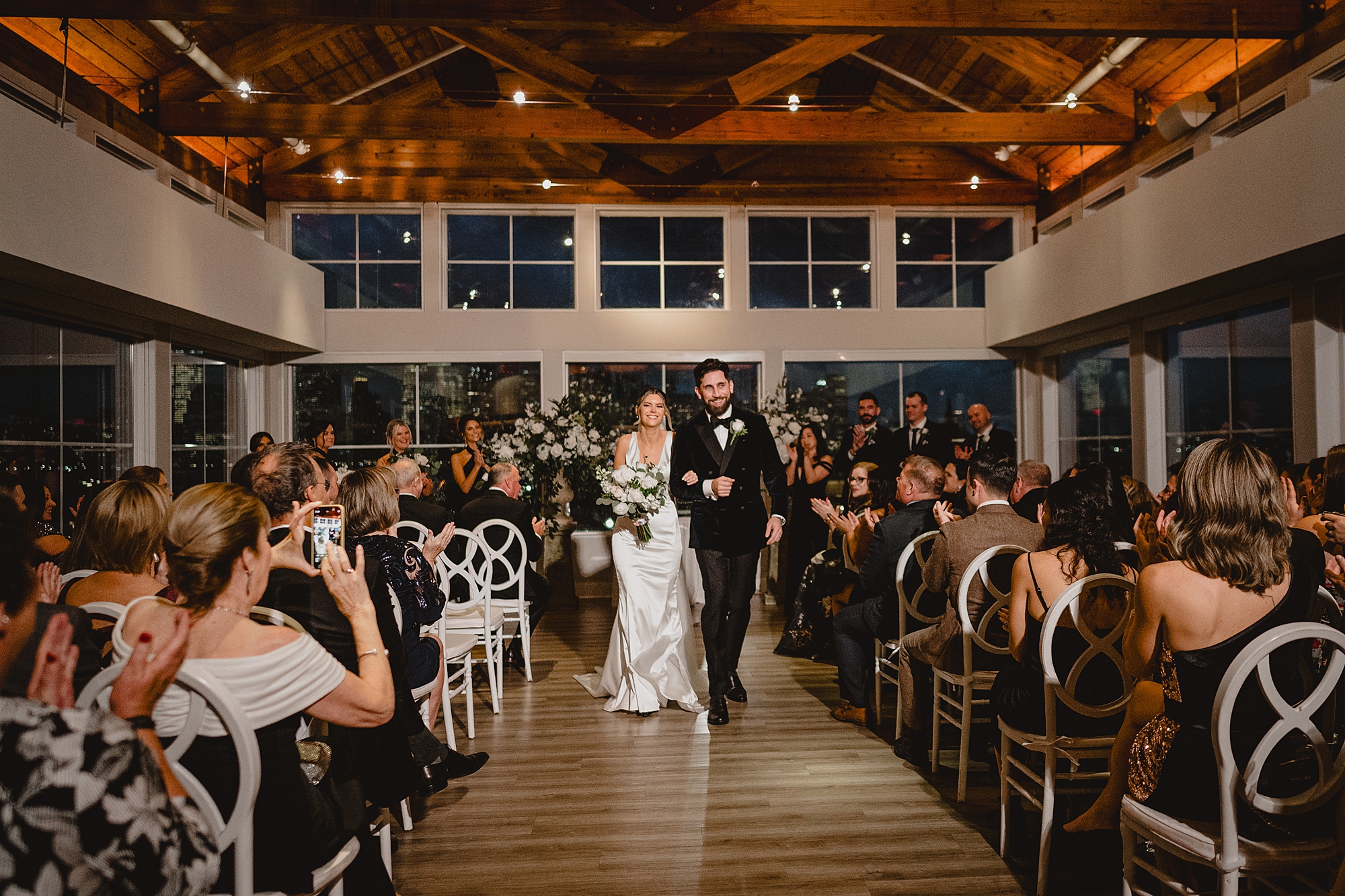 bride and groom walk up aisle after ceremony at Maritime Parc