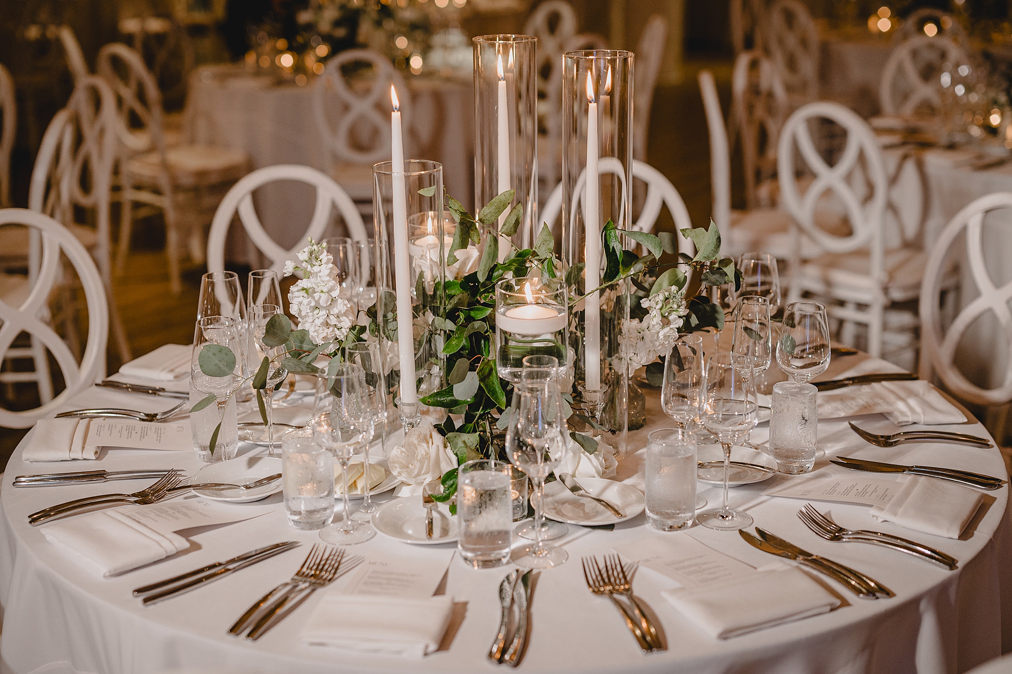 chic wedding reception with white taper candle centerpieces at Maritime Parc