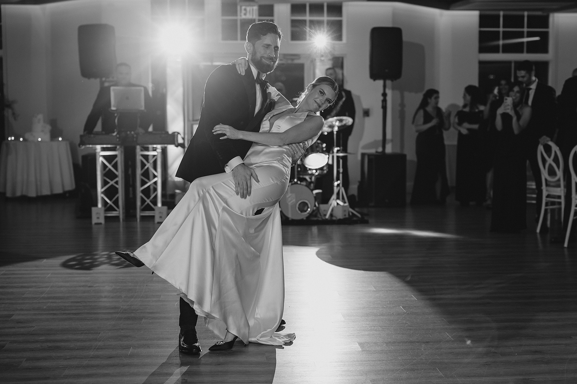 groom dips bride during first dance at Maritime Parc