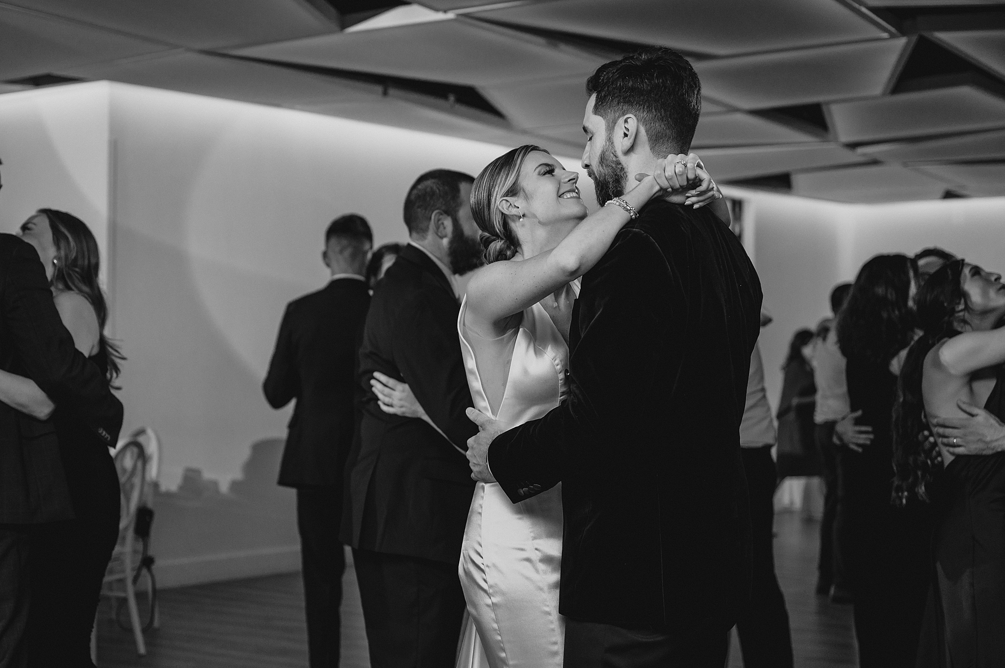 bride and groom dance with guests during NJ wedding reception