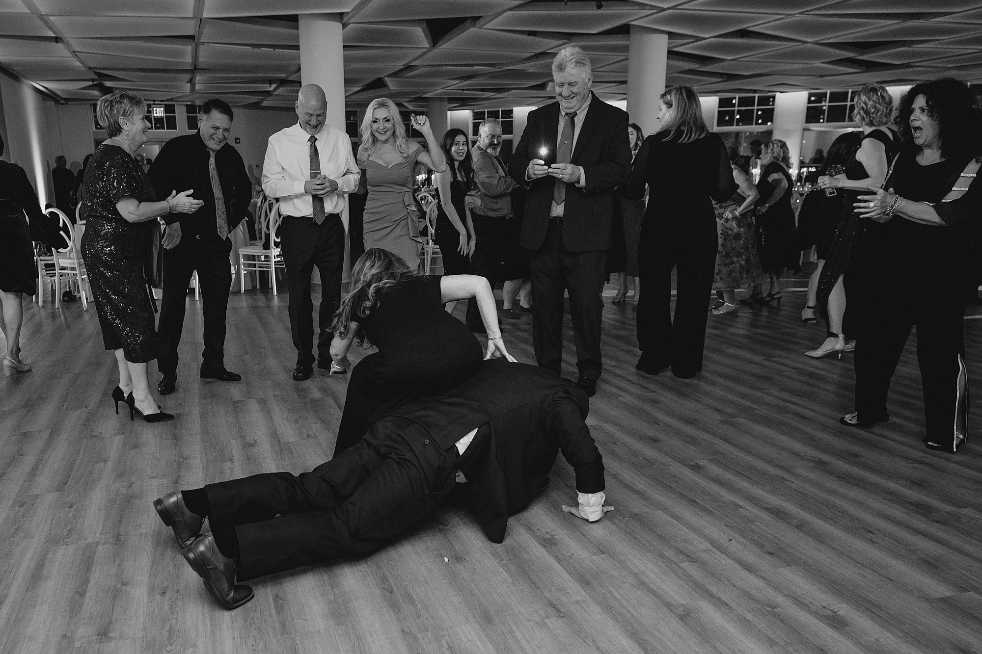 groomsmen dance on floor during NJ wedding reception