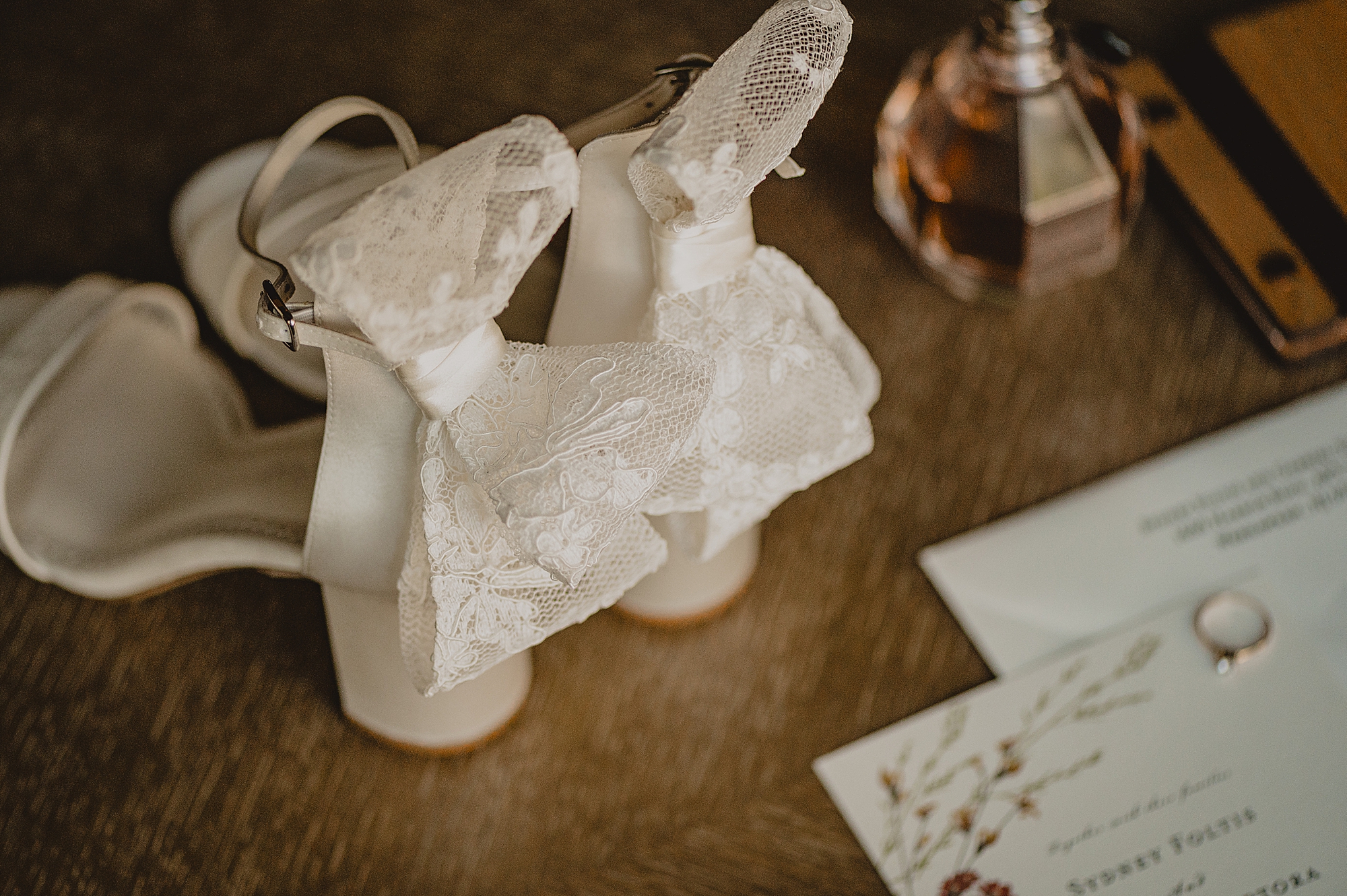lace bows on the back of white shoes for bride