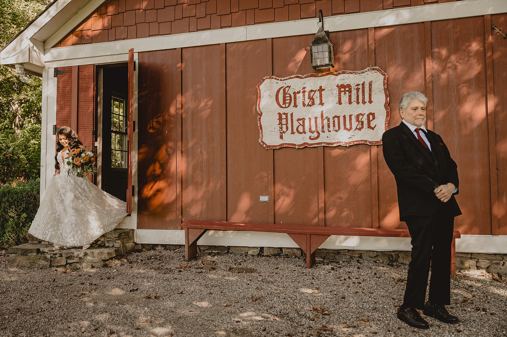 bride walks to meet father outside Grist Mill at Crossed Keys Estate