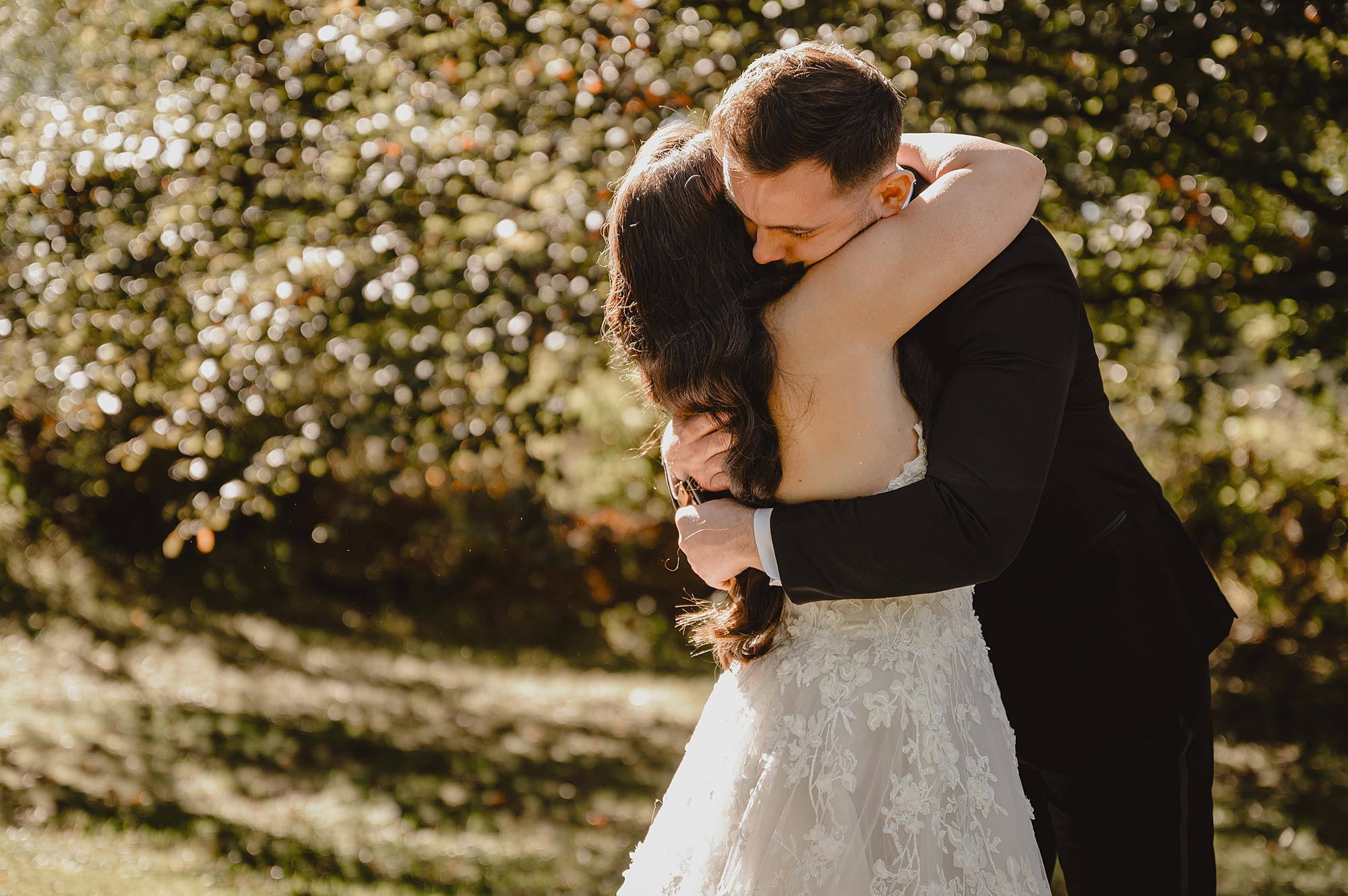 bride and groom hug during first look at Crossed Keys Estate