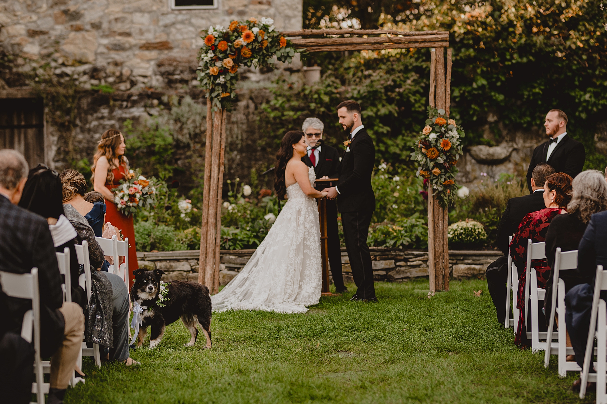 newlyweds laugh toeter during ceremony at Crossed Keys Estate