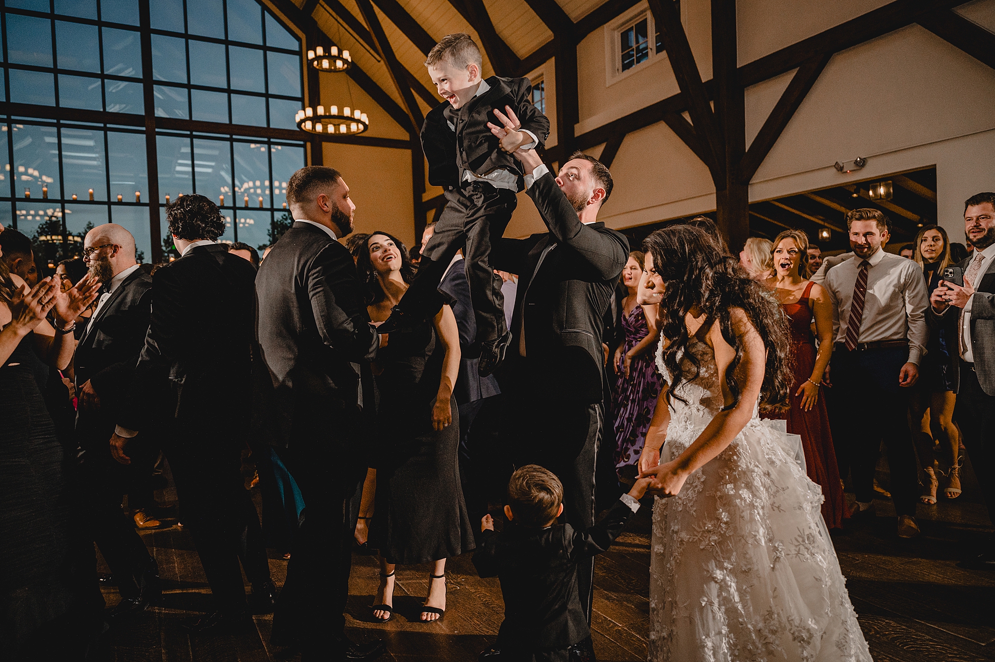 bride and groom dance together with kids at Andover NJ wedding reception