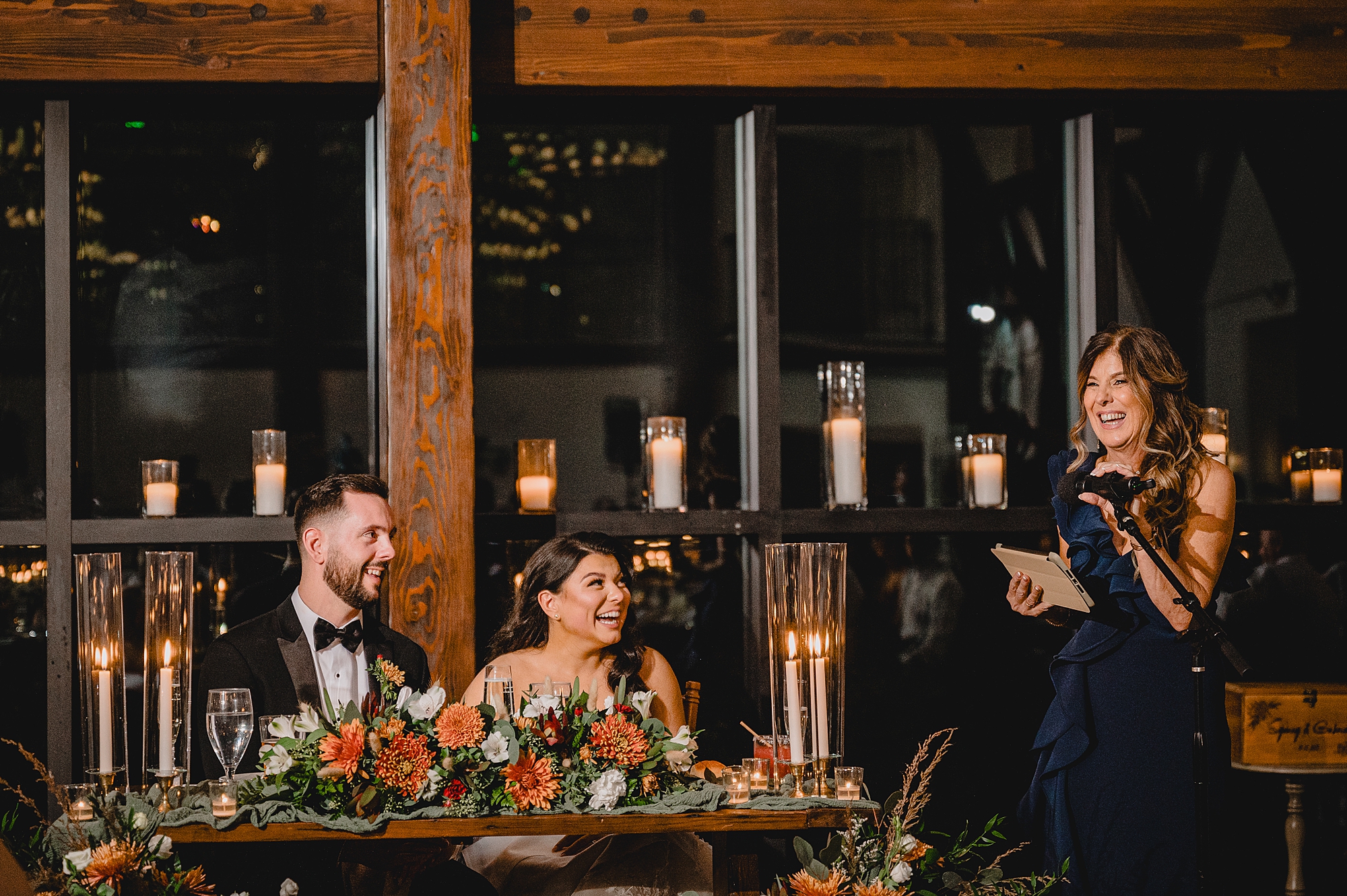 newlyweds listen to toasts during Andover NJ wedding reception