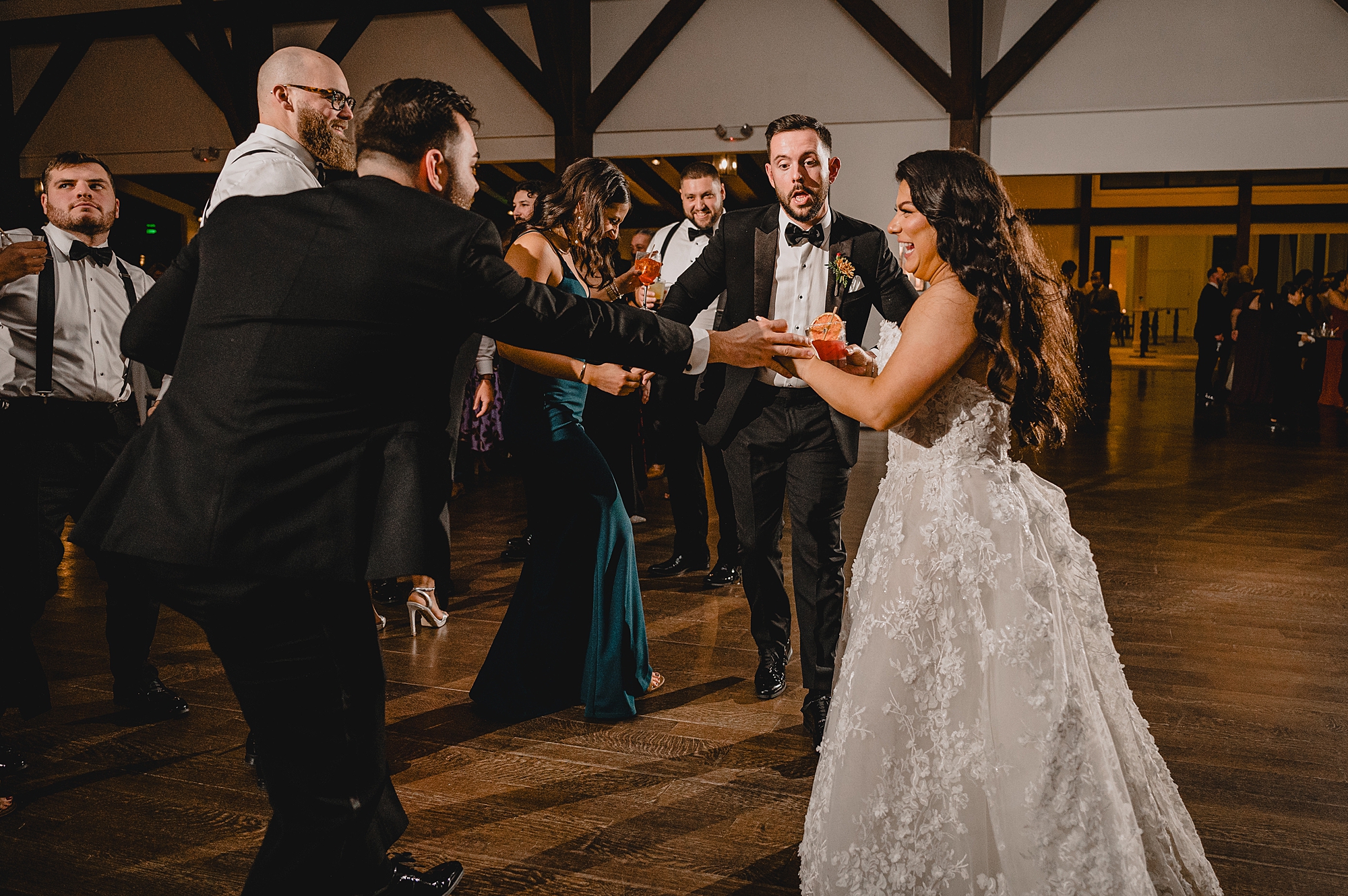 bride and groom dance with guests during Andover NJ wedding reception