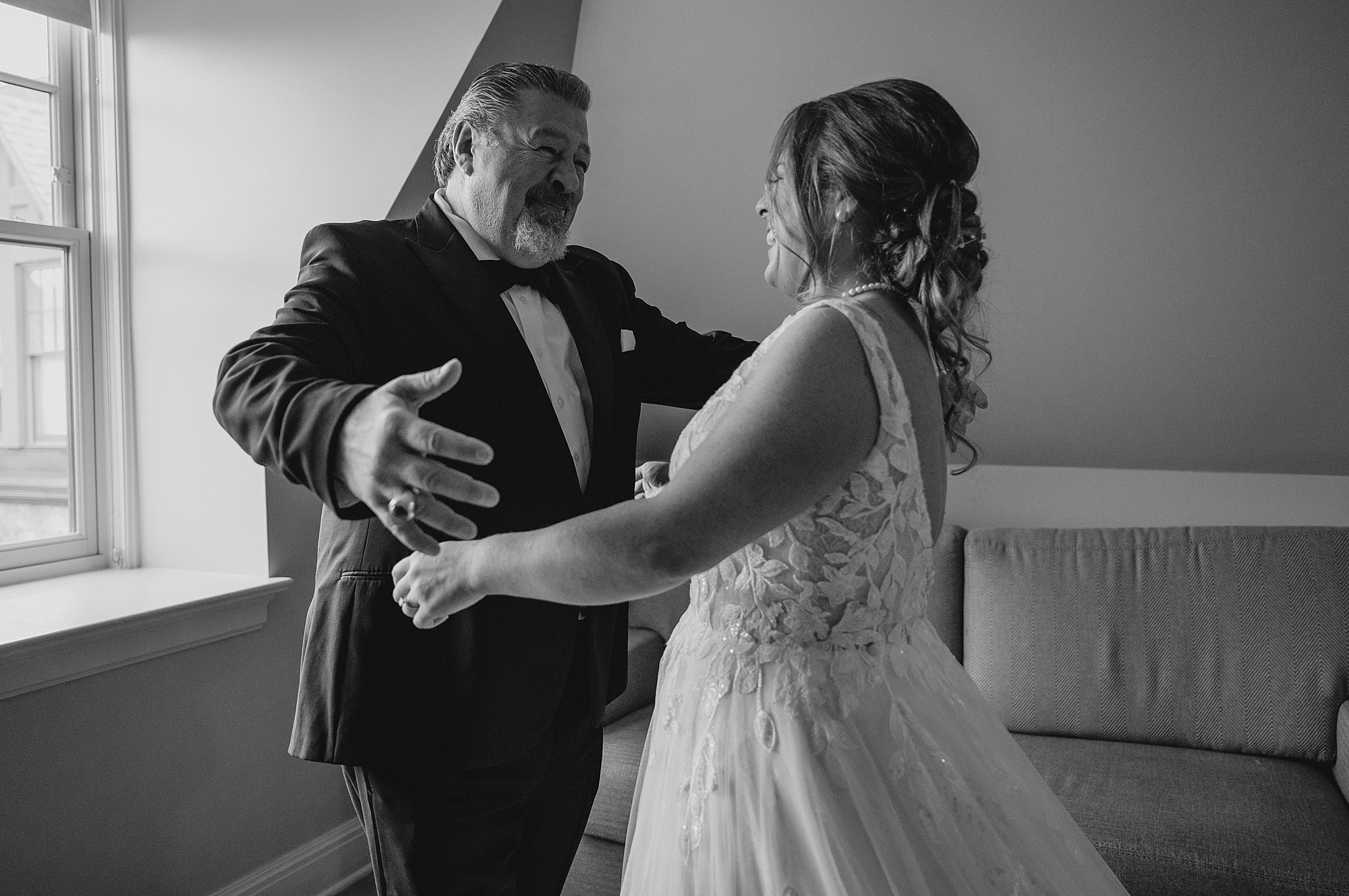 bride hugs dad during first look before NY wedding day