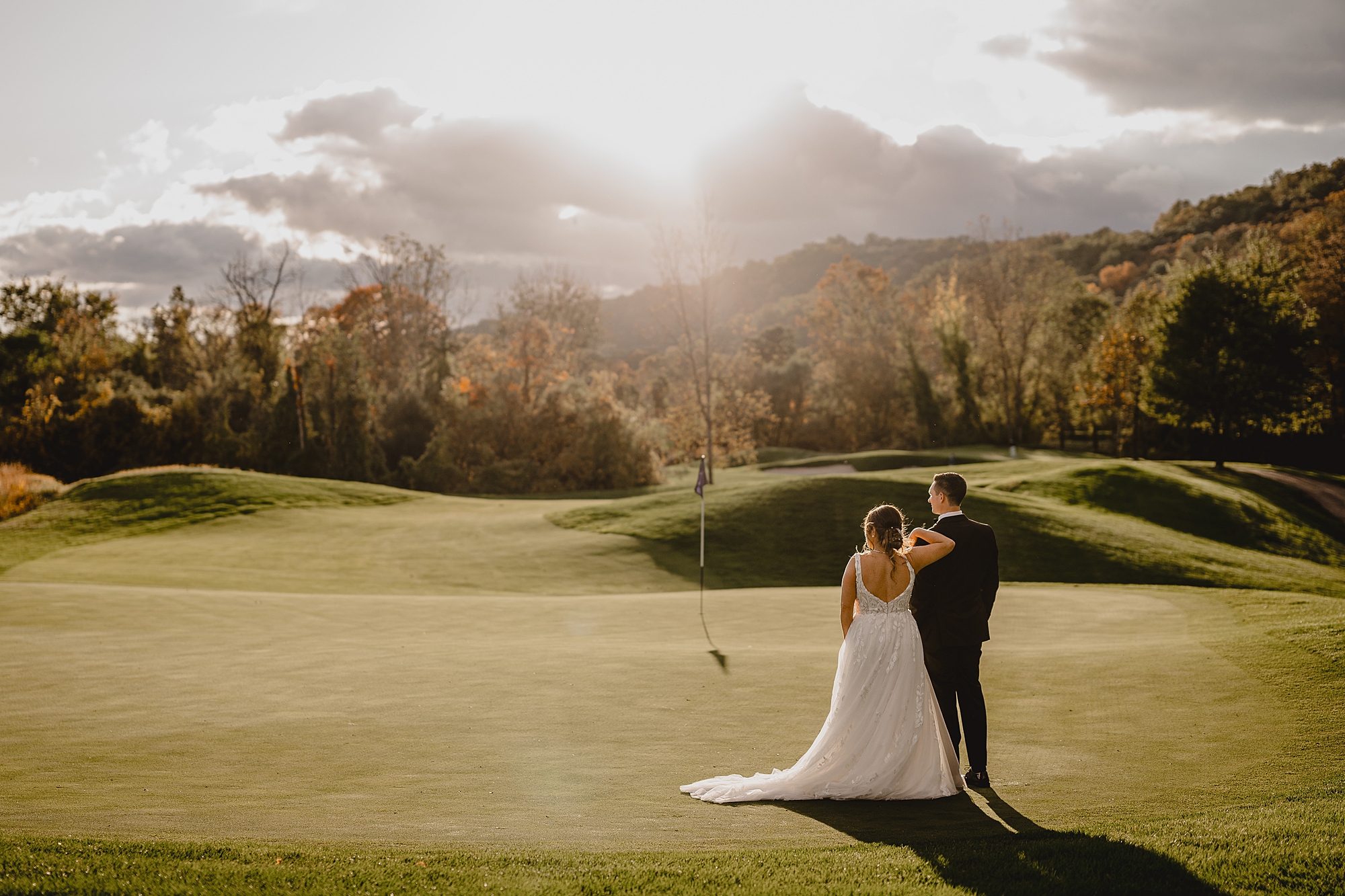 bride and groom look at Hollow Brook Golf Club