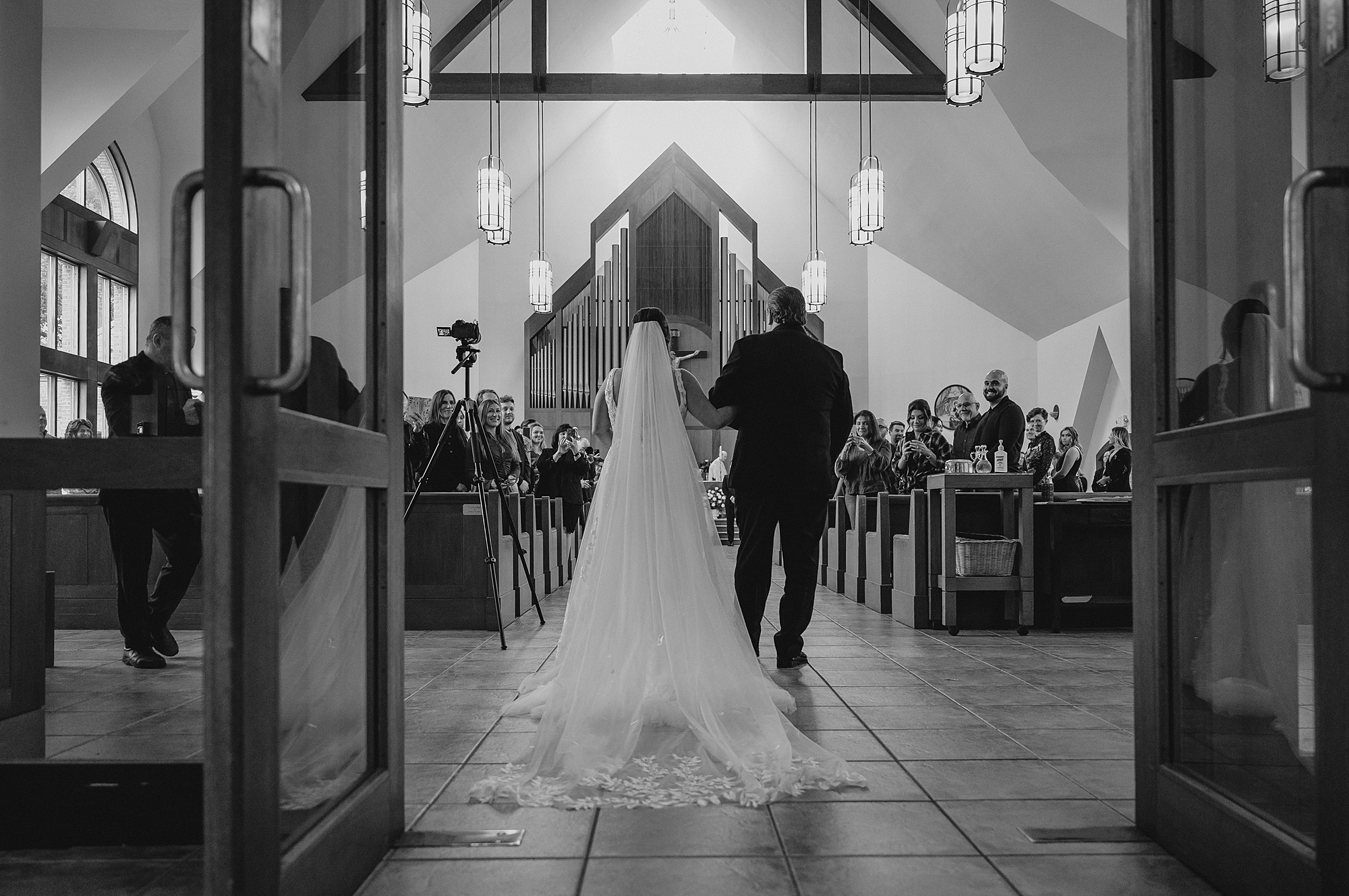 father escorts bride down aisle for traditional church ceremony in New York