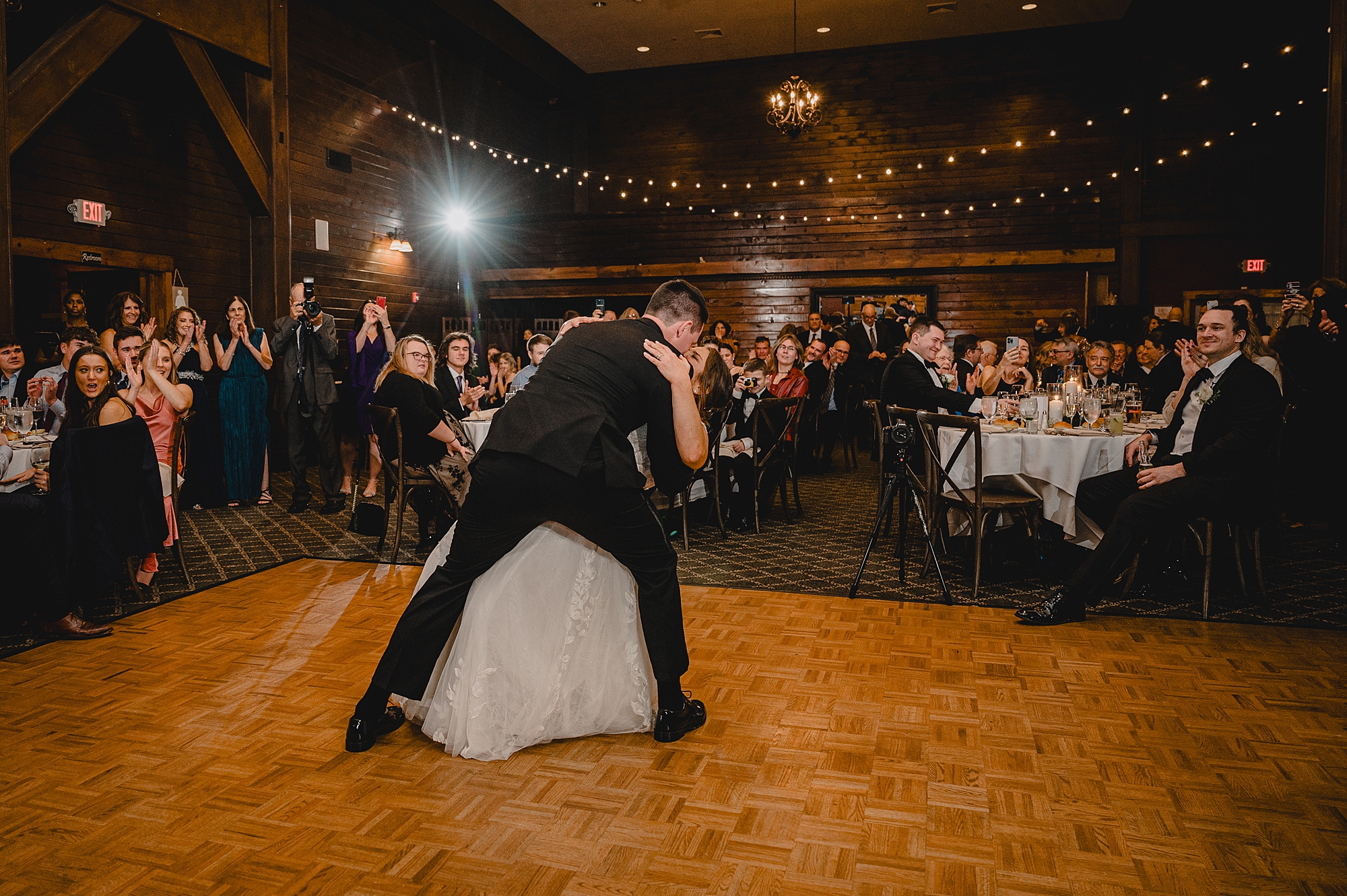 groom dips bride on dance floor at Cortlandt, NY reception