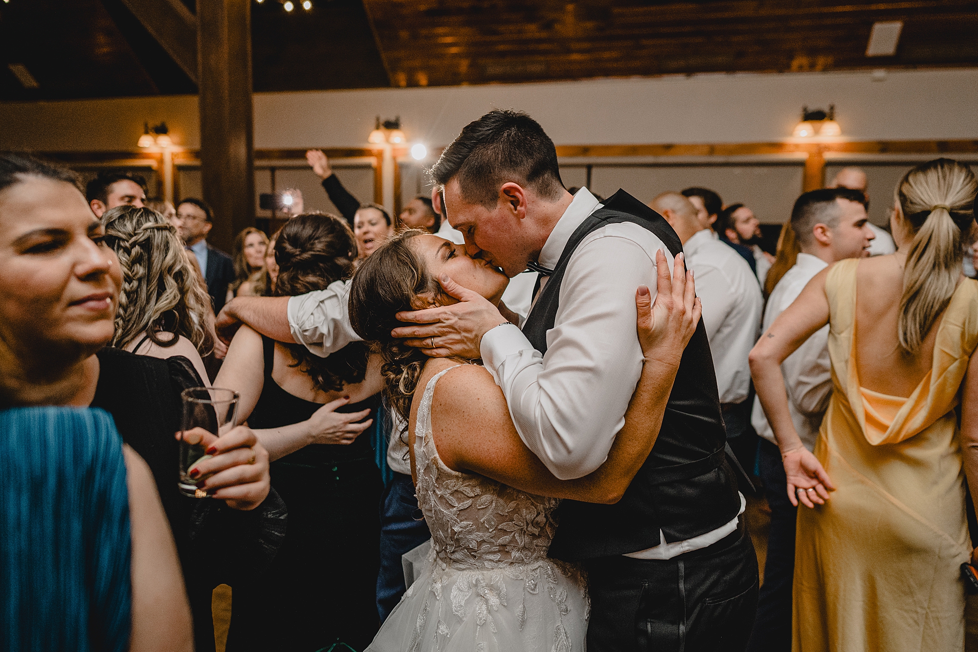 newlyweds kiss on dance floor at reception