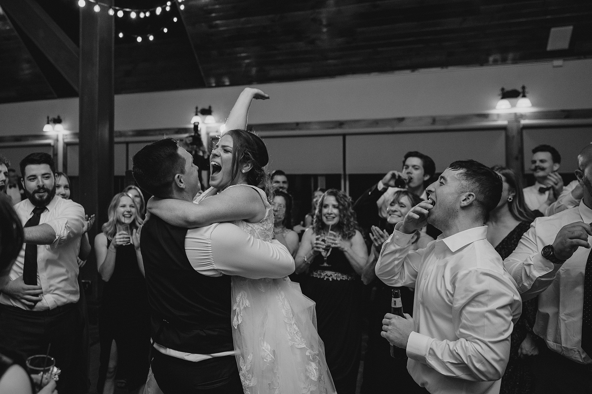 newlyweds kiss on dance floor at reception