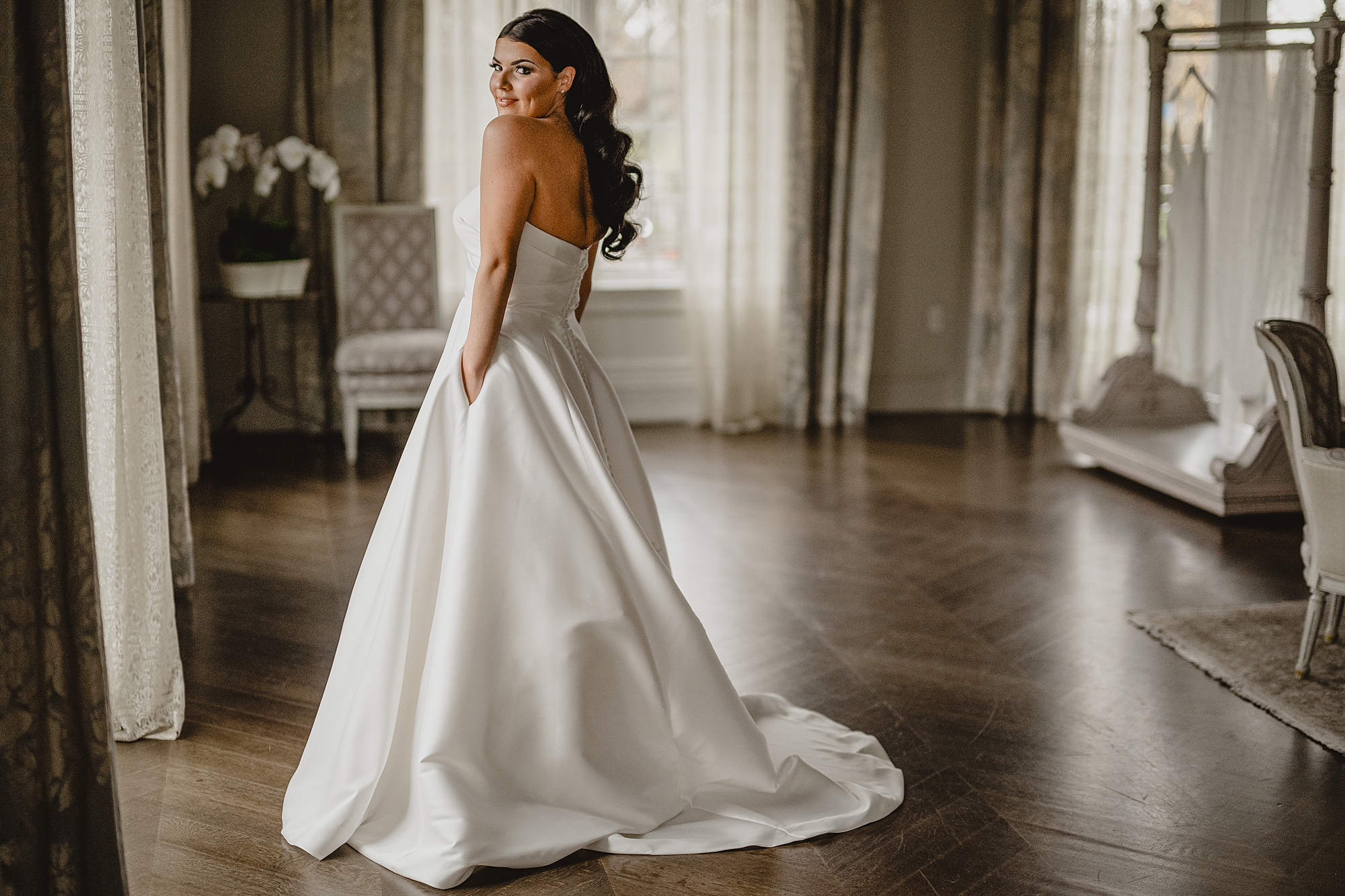 bride twirls in bridal suite at Park Chateau