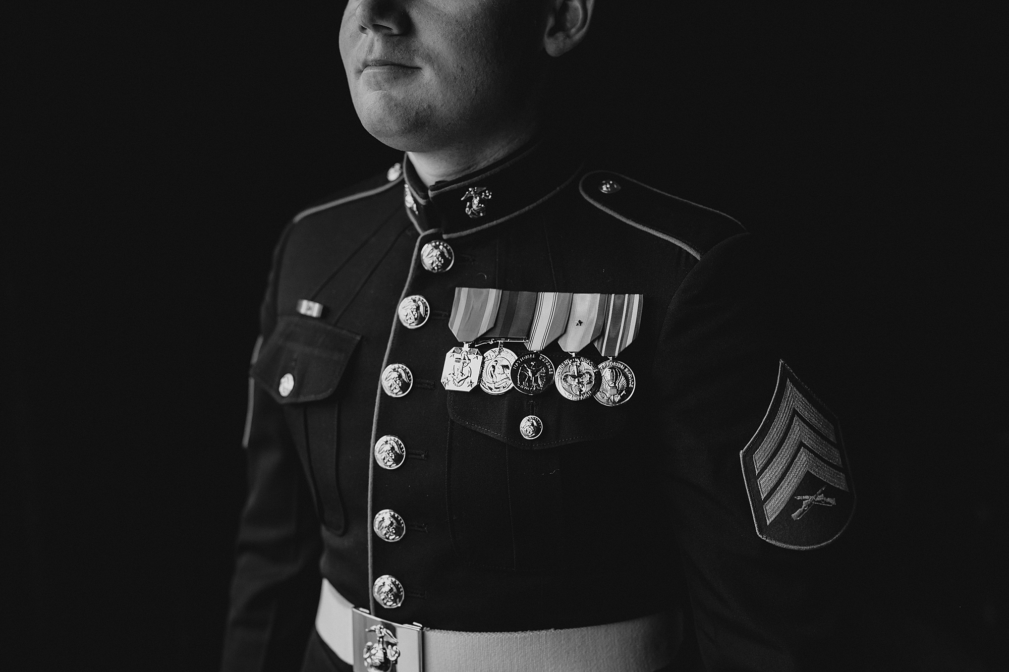 groom stands in marines uniform 