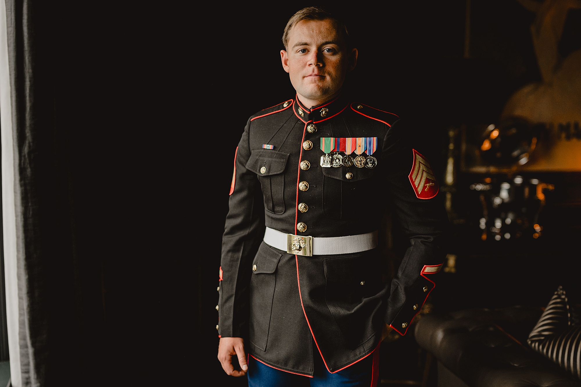 groom stands at attention in Marines uniform 