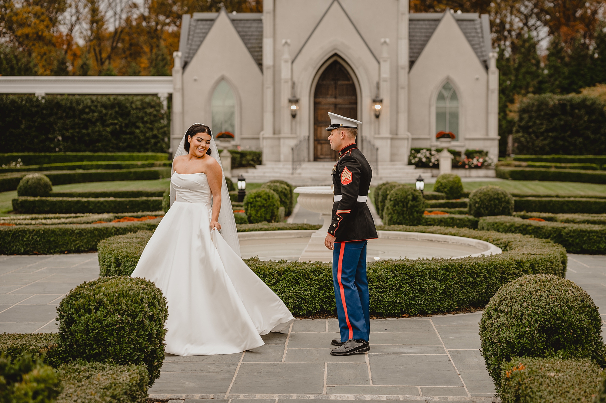 bride twirls in wedding dress showing Marine outside chapel at Park Chateau