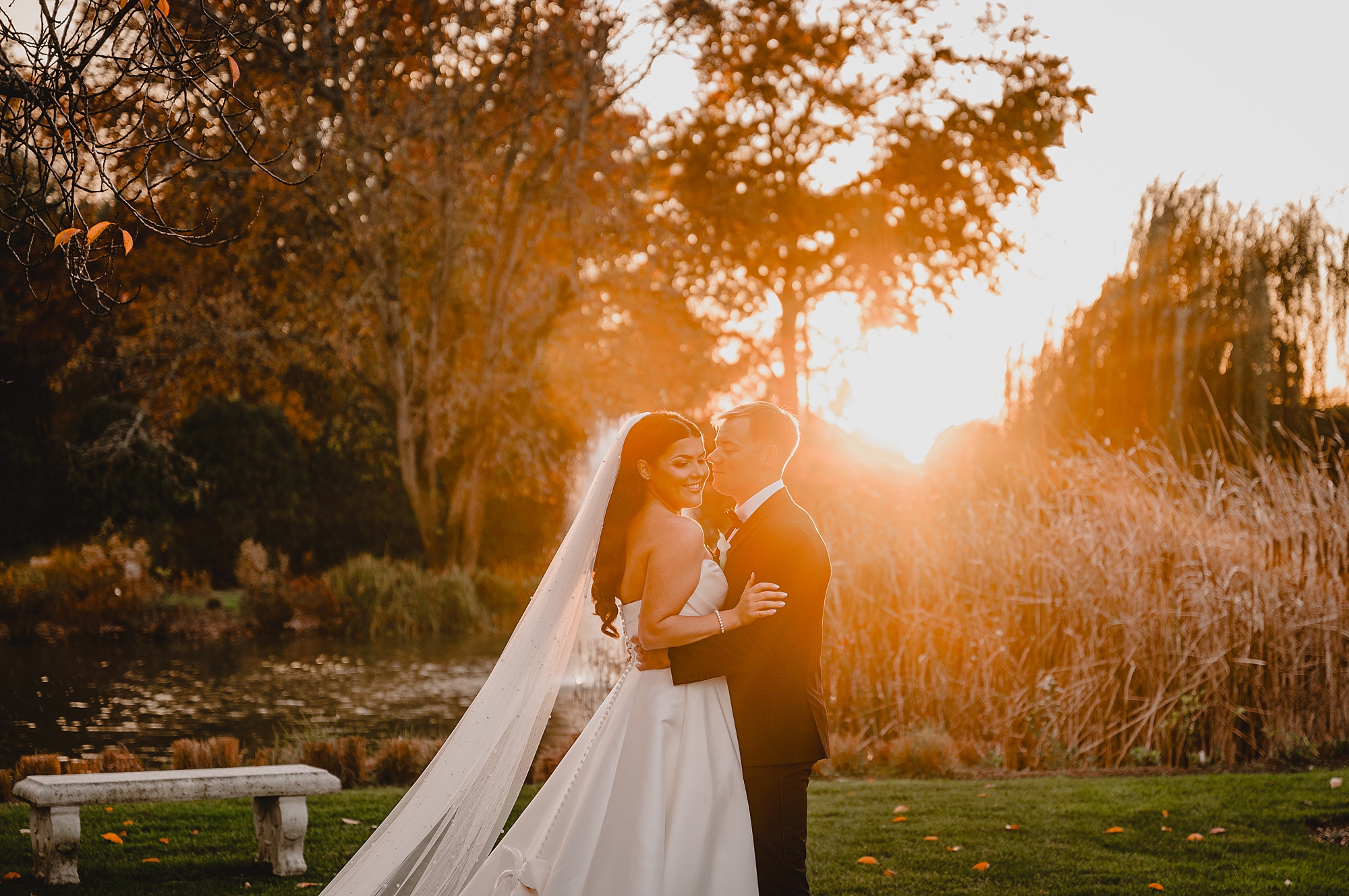 newlyweds hug at sunset in New Jersey at Park Chateau