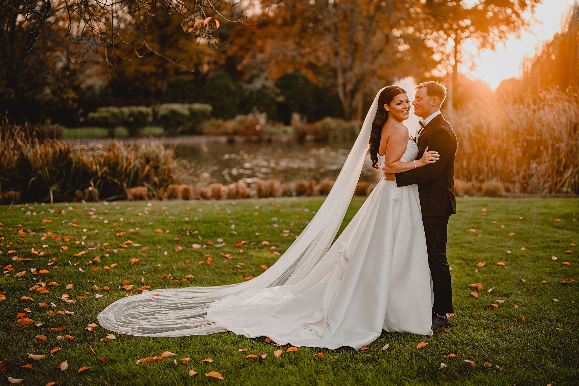 bride and groom hug near fountain at Park Chateau