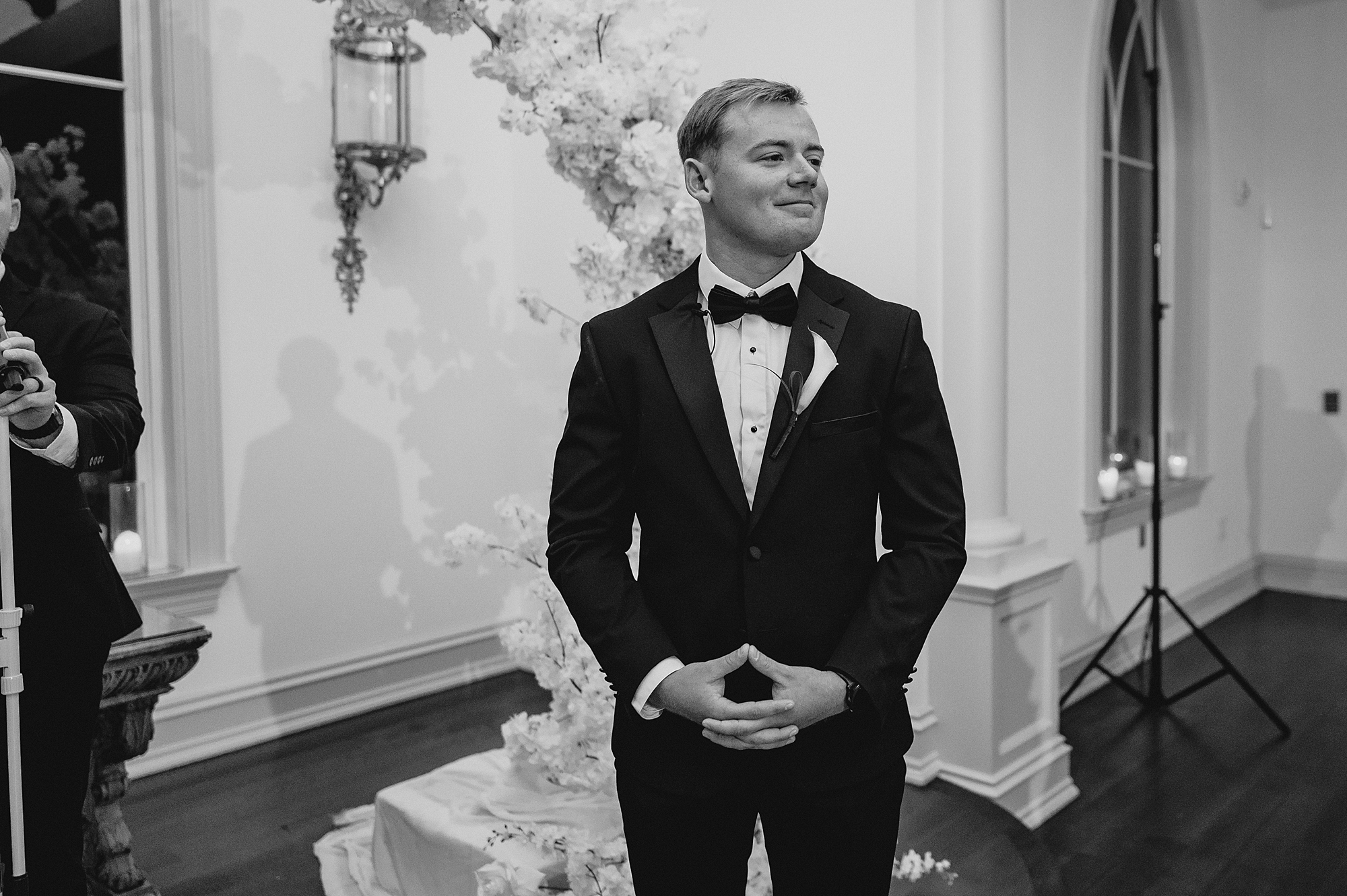 groom waits for bride during ceremony at Park Chateau chapel 