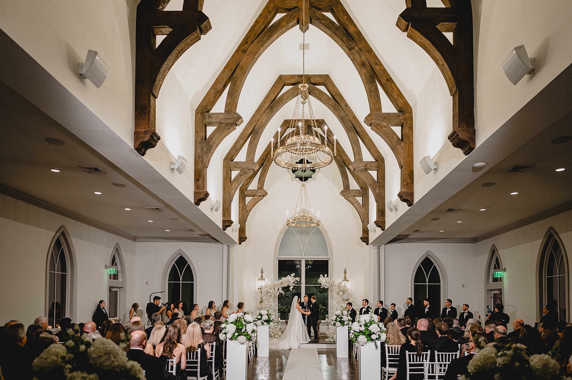wedding ceremony at night at Park Chateau chapel
