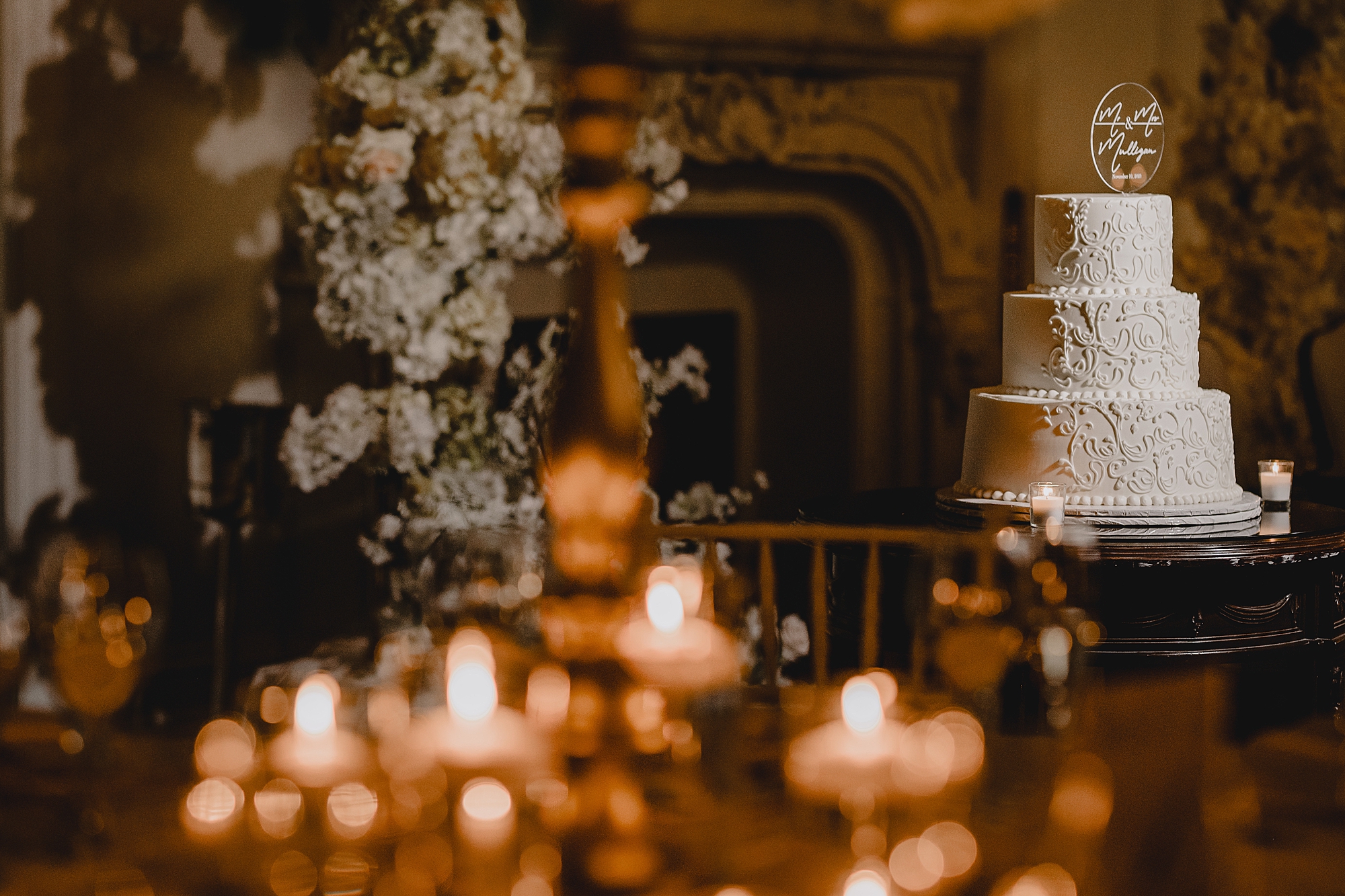 wedding reception at Park Chateau Estate with candles and tiered white cake