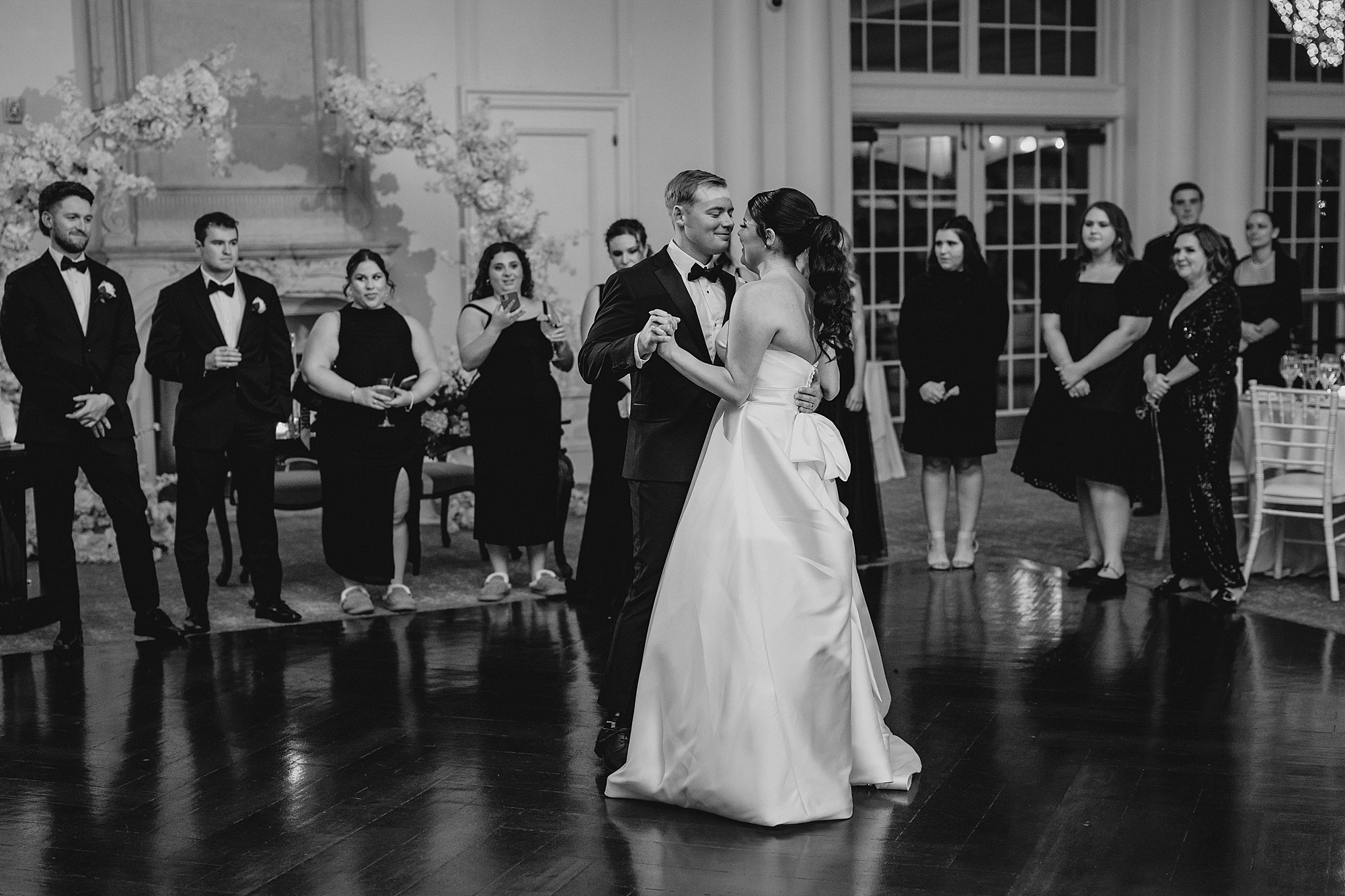 bride and groom have first dance on dance floor at Park Chateau Estate