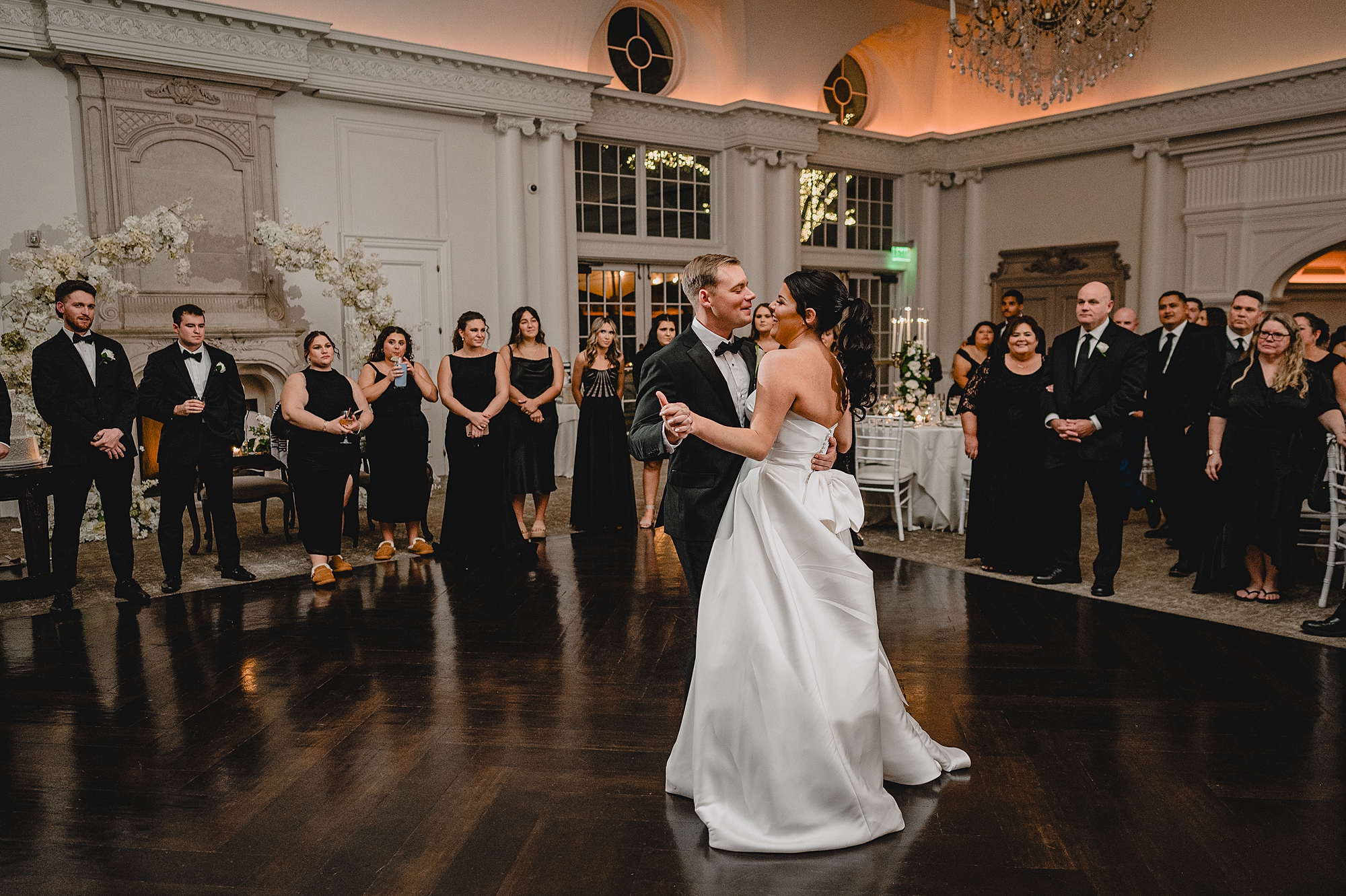 bride and groom dance together at Park Chateau Estate