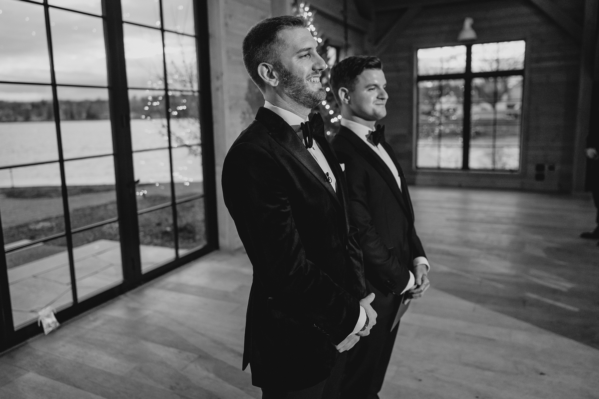 groom stands waiting for bride to walk down aisle 