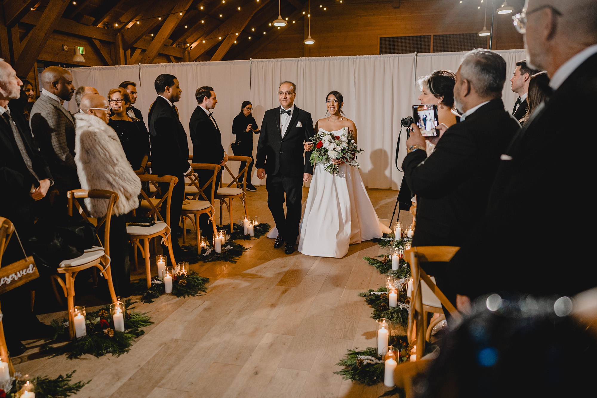 bride and father walk down aisle for ceremony at the Lake House at Canandaigua