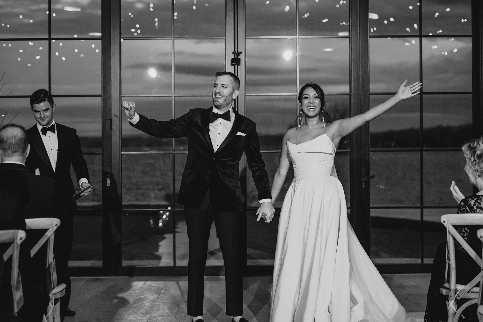 newlyweds cheer after wedding ceremony at the Lake House at Canandaigua