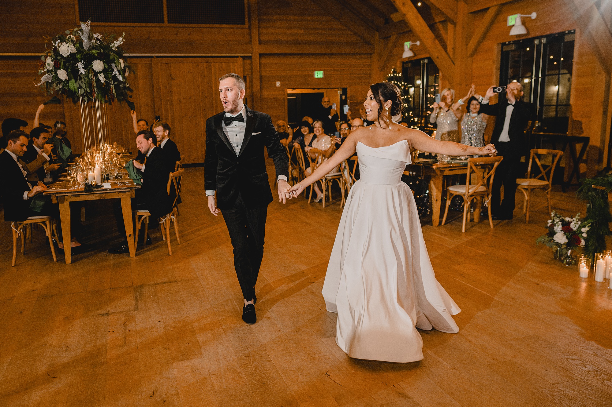 groom twirls bride on dance floor at the Lake House at Canandaigua