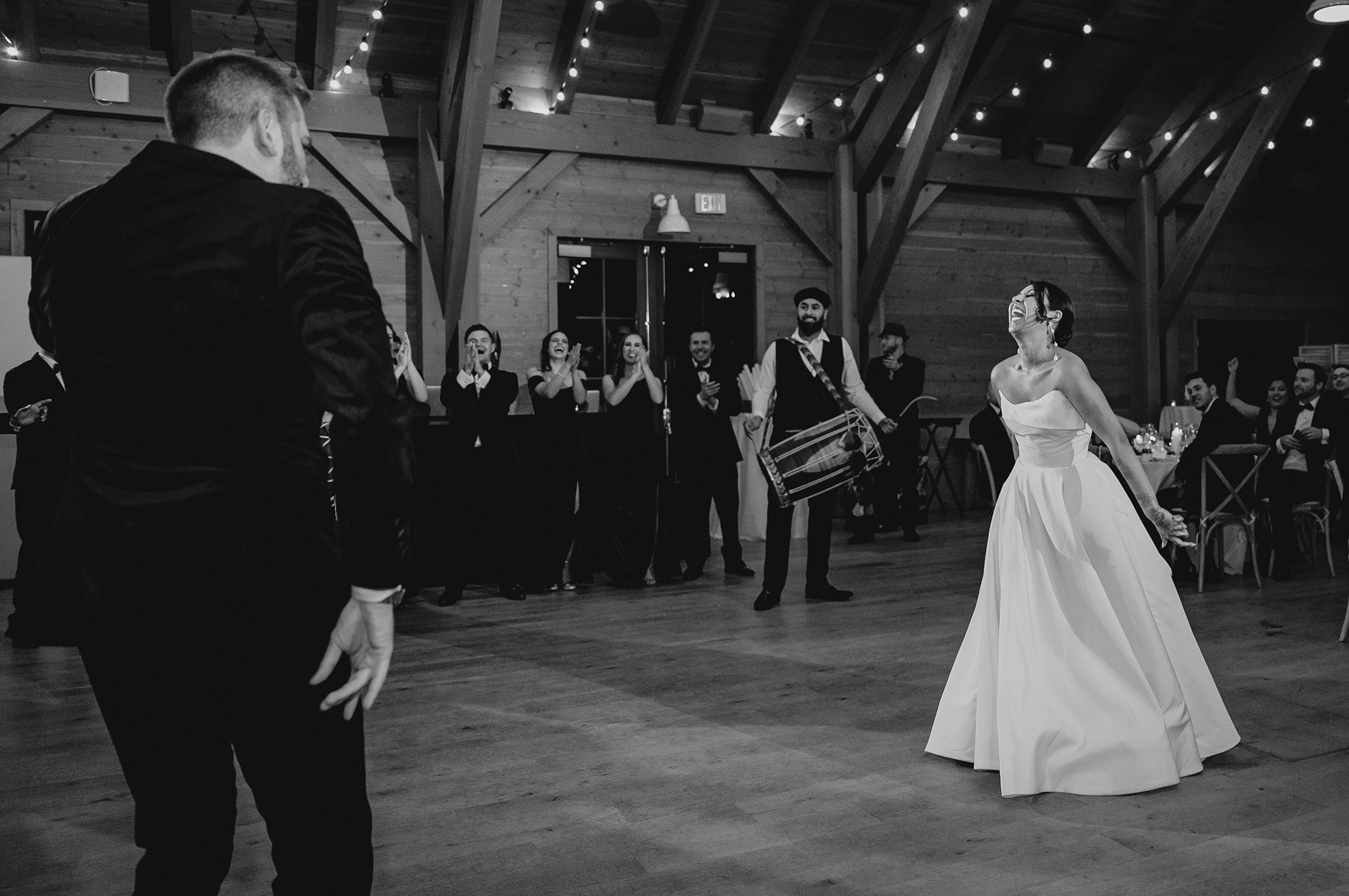 bride sings at groom during first dance at the Lake House at Canandaigua