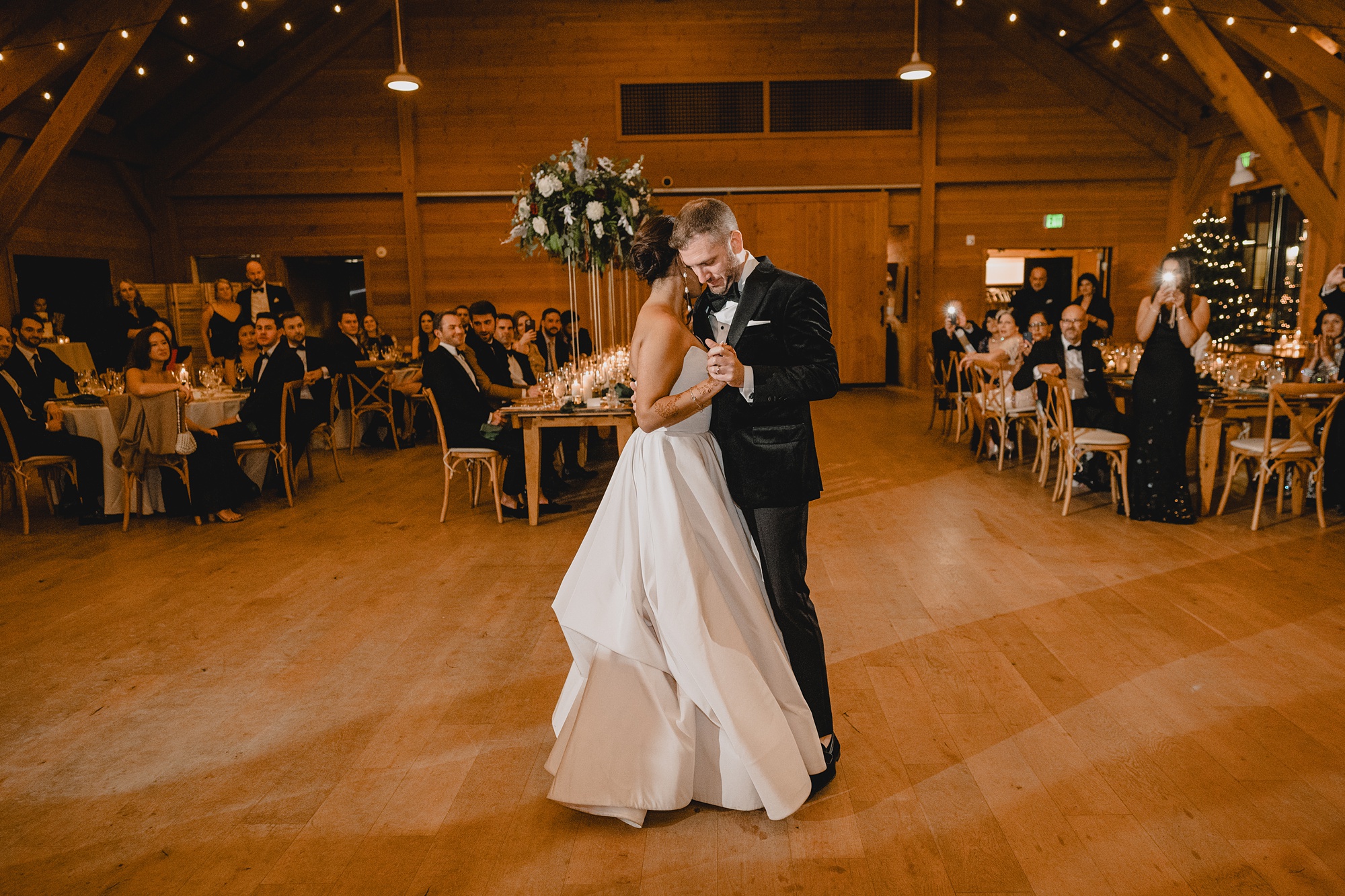 bride and groom dance together at the Lake House at Canandaigua