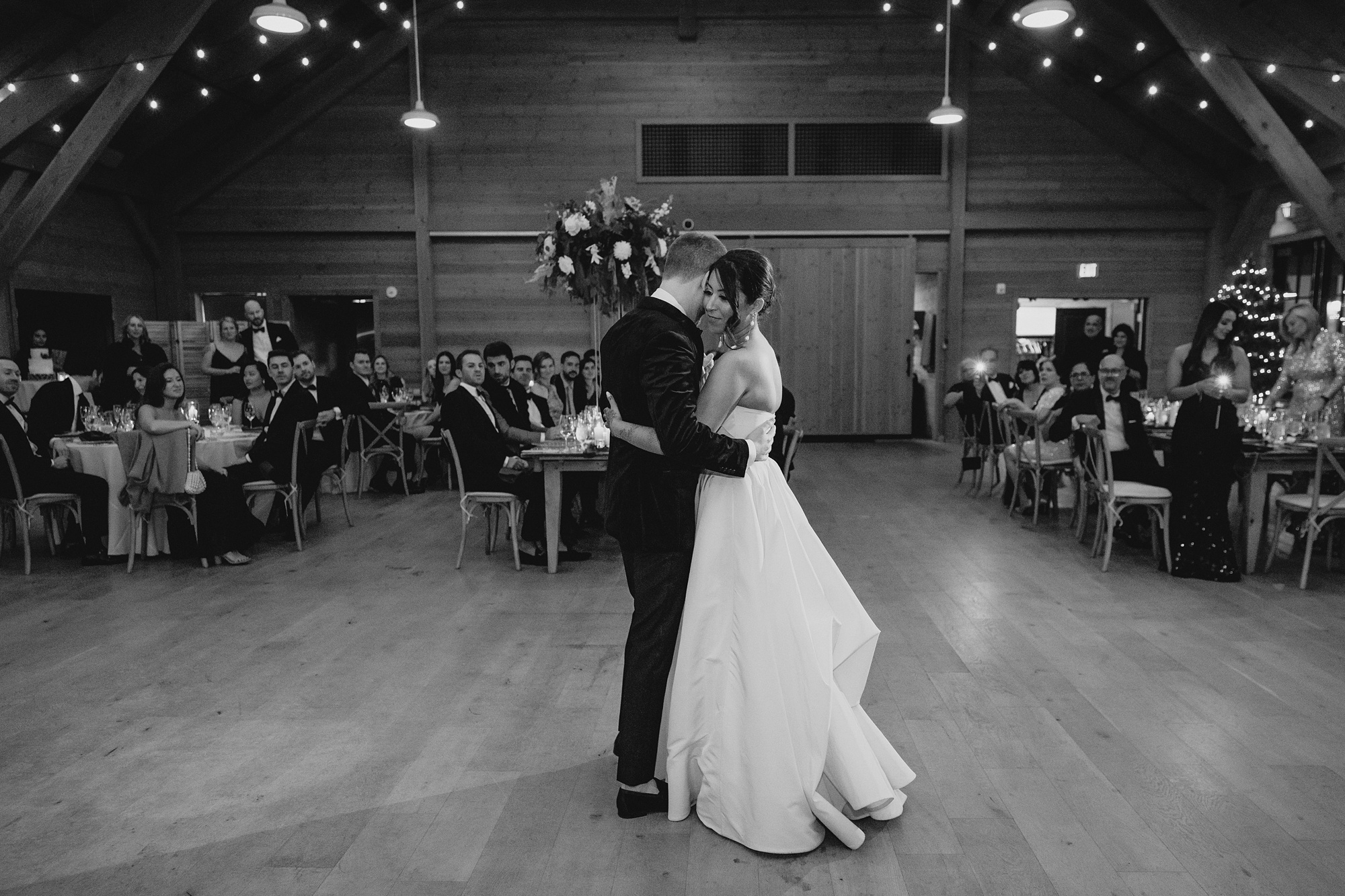 bride and groom hug on dance floor at the Lake House at Canandaigua