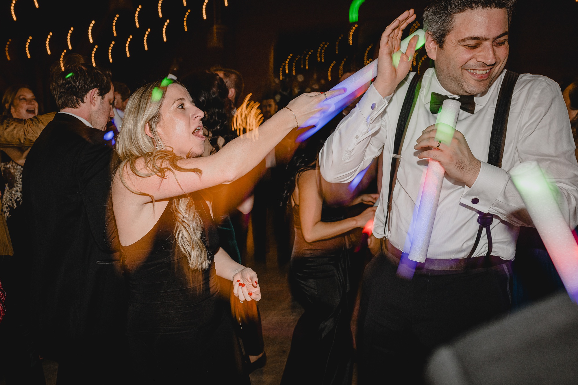 guests dance during winter wedding reception in New Jersey