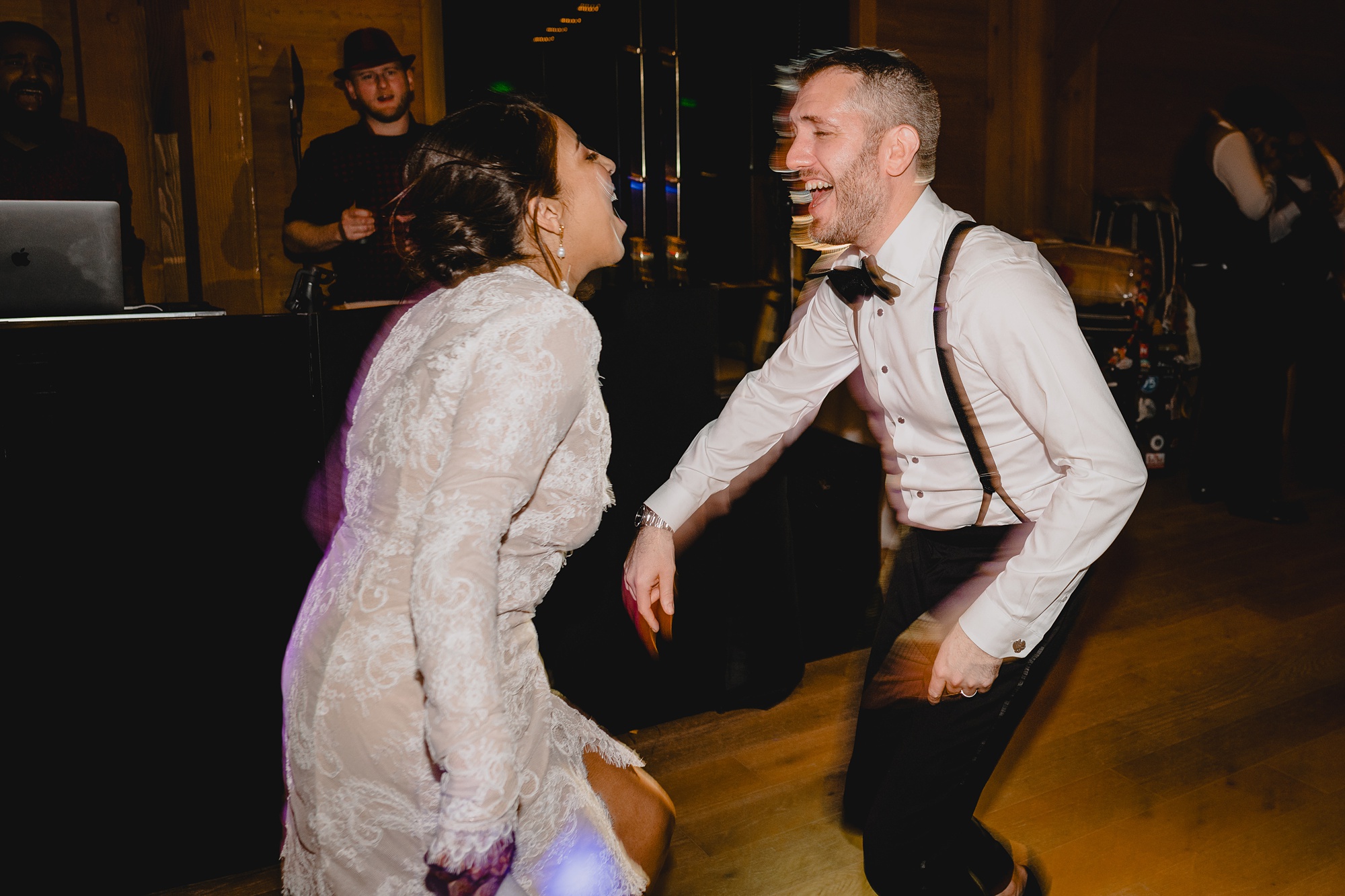 bride and groom dance together during winter wedding reception in New Jersey