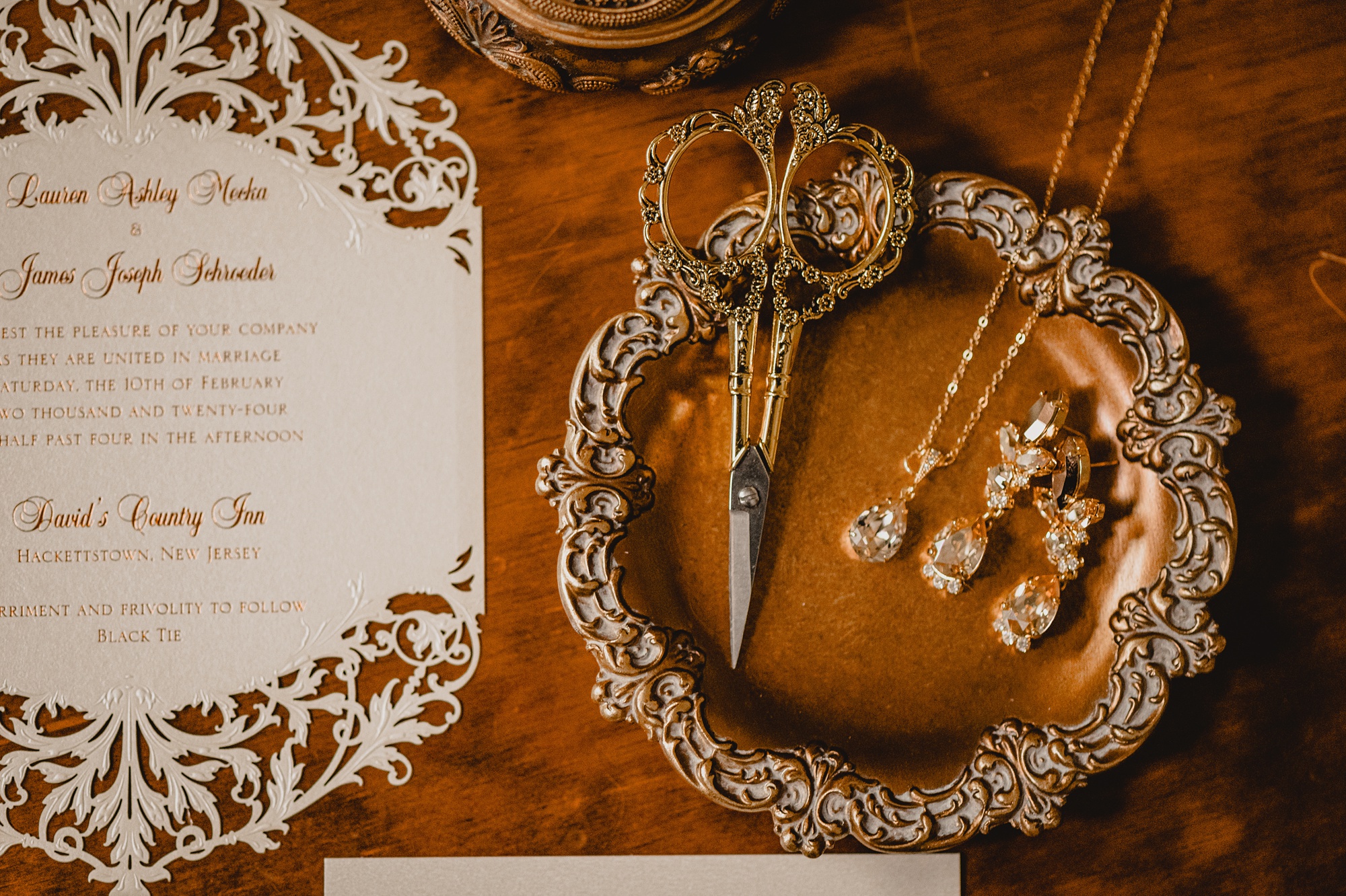 bride's jewelry, scissors, and delicate lace inspired invitation suite