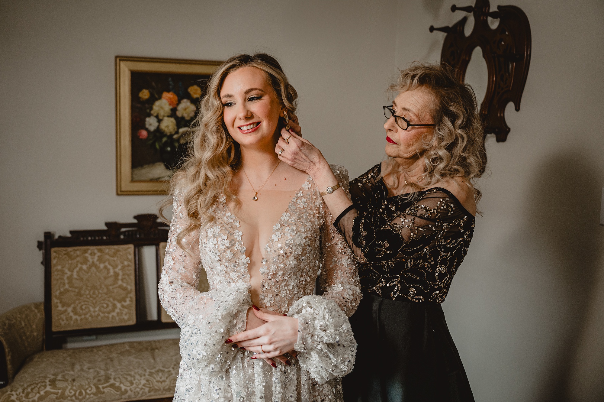 mother adjusts earrings for bride inside bridal suite at David's Country Inn