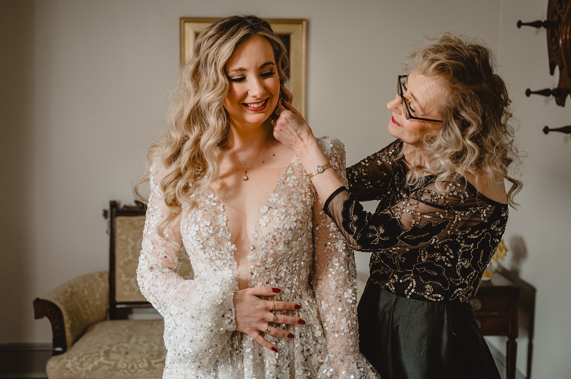 mother helps bride prepare for winter wedding at David's Country Inn